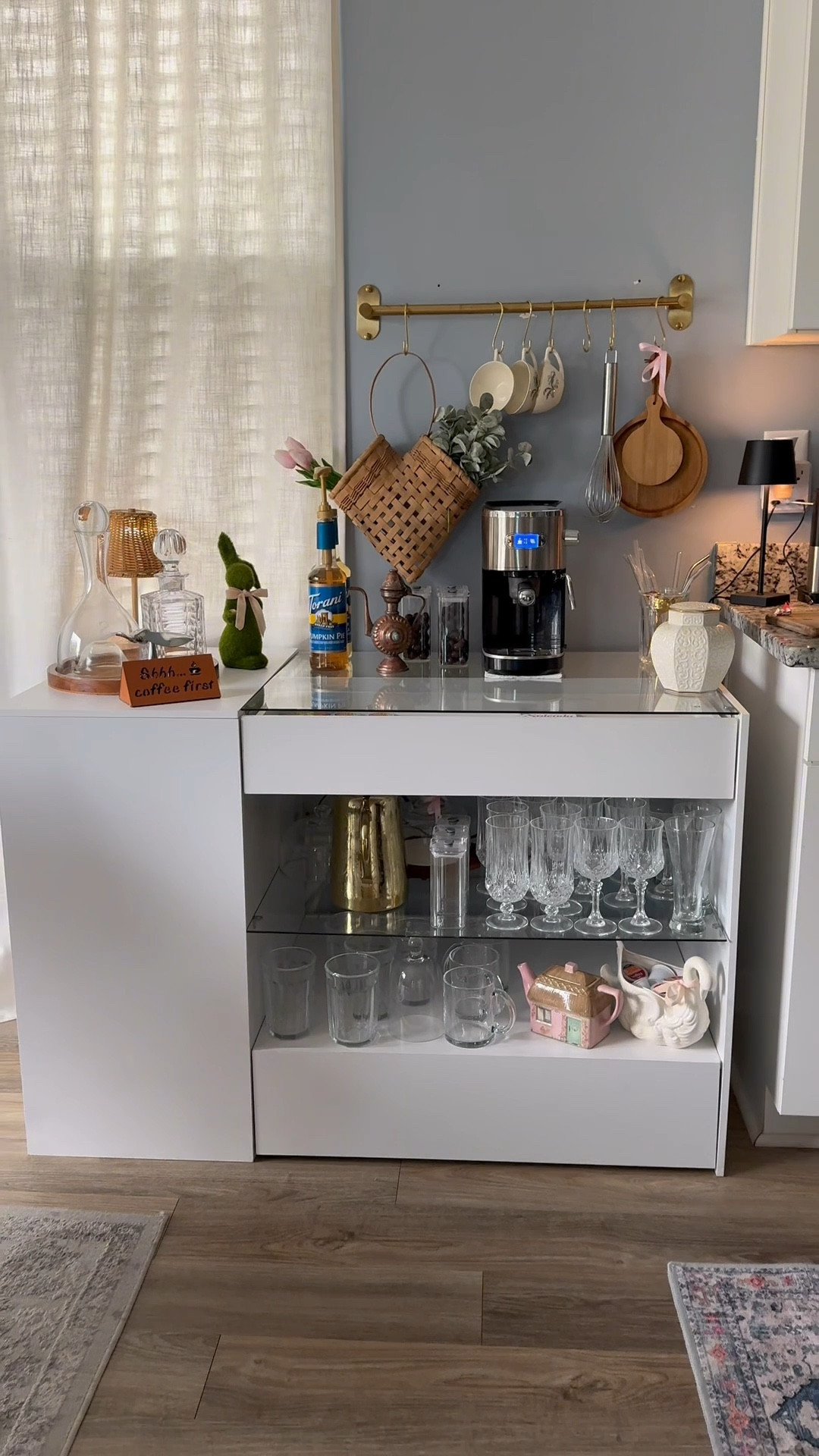 Amazon finds! Gold bar with Gold hooks, Espresso maker, white cabinet, coffee, coffee syrups, kitchen lamp!
Make no mistake...everything else is thrifted. (China, cutting boards, decanters, coffee sign, glasses, etc...)  #ThriftedHomeDecor #VintageAesthetic #HomeDecorOnABudget #HomeMakeover

#LTKSaleAlert #LTKHome #LTKStyleTip
