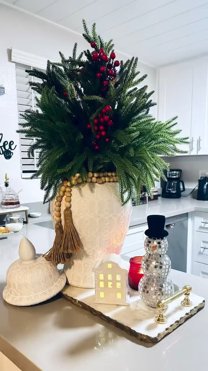 Ginger Jar Pine branches centerpieces 
Idea!

 Comment  LOVE THIS to get the details to this Christmas centerpiece idea sent to your inbox!

 Click on the “Shop  HOME collage” collections on my LTK to shop.  You need to be following me @winsometaylorlifestyle to get the links I send you! 

Follow for more seasonal, home, home decor, decor, kitchen, beauty, fashion, winter,  valentines, spring, Easter, summer, fall!  Have an amazing day. xo💋 

#christmasdecor #christmascenterpiece #christmas  #tistheseason #LTKVideo 

#LTKSeasonal #LTKHoliday
