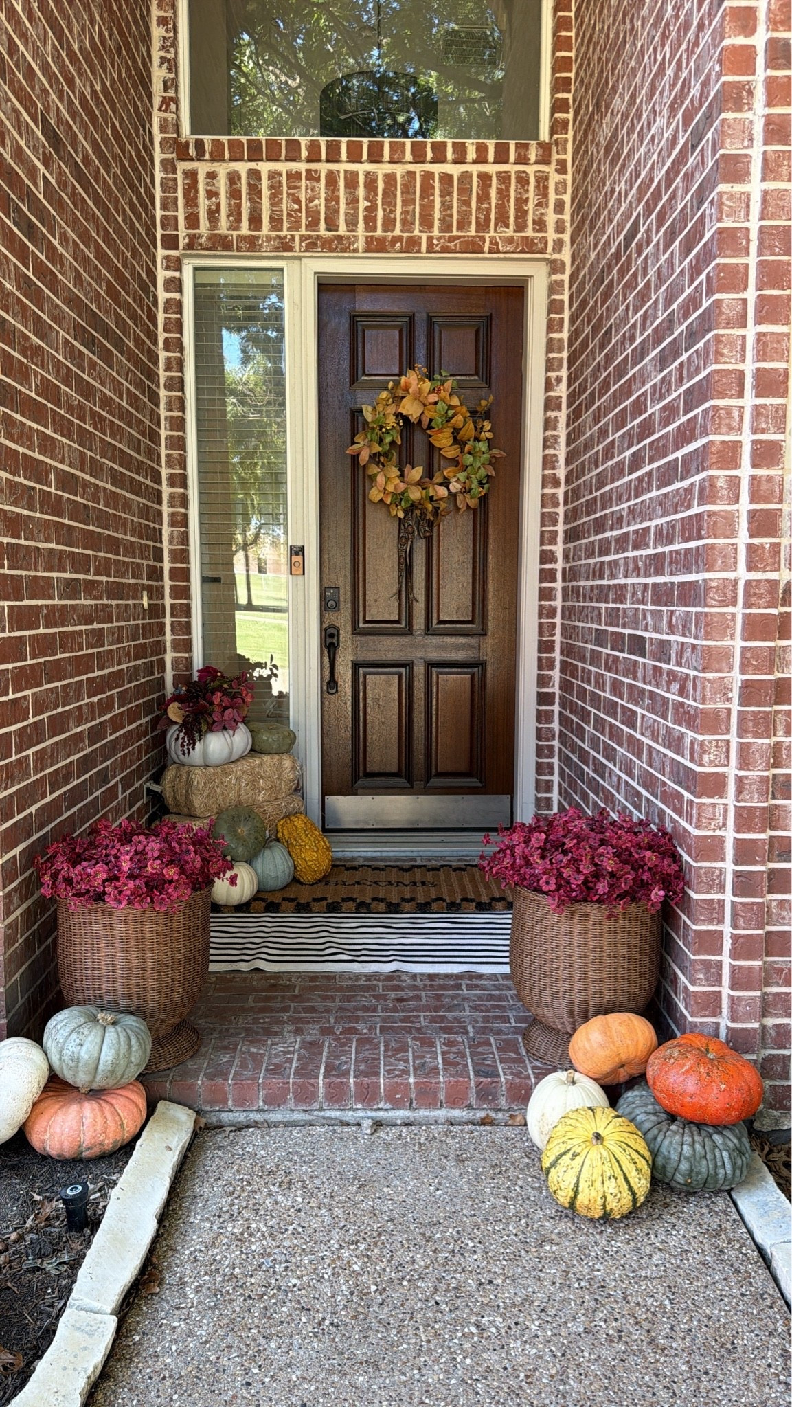 Fall front porch decor! 🍁🍃🍂 Absolutely loving these rattan planters!