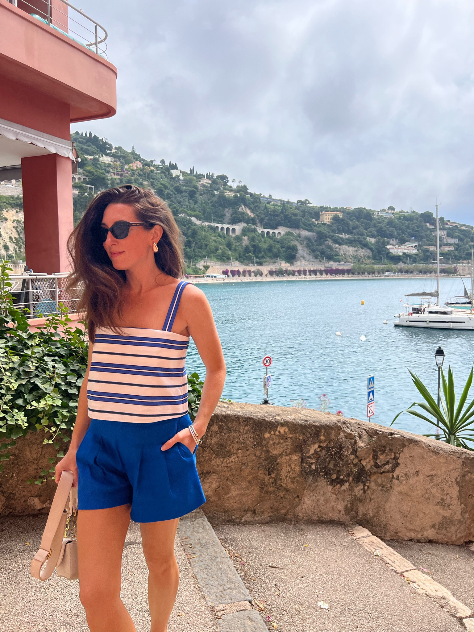 Summer Blues! 💙🤍 The straps of this top are so unique because they button in the back so you can adjust to your desired fit! The pleased lineny shorts are from the same collection to pair perfectly! I’ve paired them so the my silver mary jane ballet flats for comfy walking around Villefranche! 

+adding some of my other mix and match summer pieces I packed for the trip! 

#LTKTravel #LTKShoeCrush #LTKStyleTip