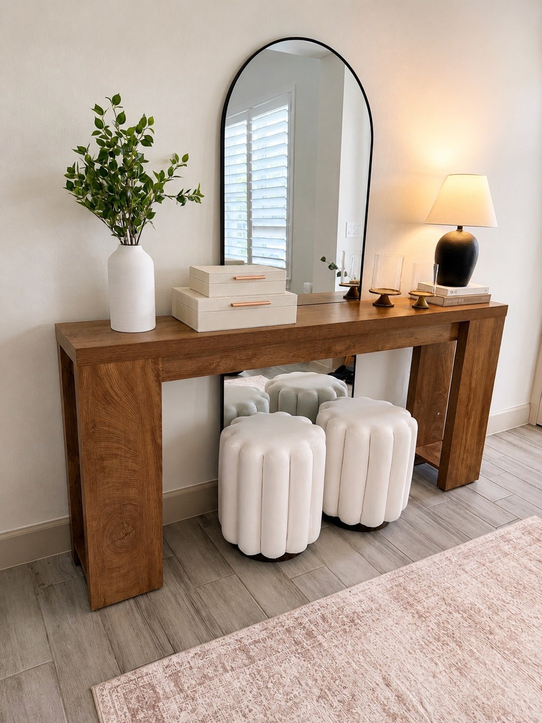 Finally pulled this little entryway space together and I’m obsessed with how warm and cozy it feels 🤎 The arched mirror, soft rug, and neutral decor make it feel so high-end without trying too hard. Everything is linked!  ✨ #LTKhome #NeutralHome #EntrywayDecor #ModernHome #CozyHome #HomeStyling #OrganicModern #LTKFinds