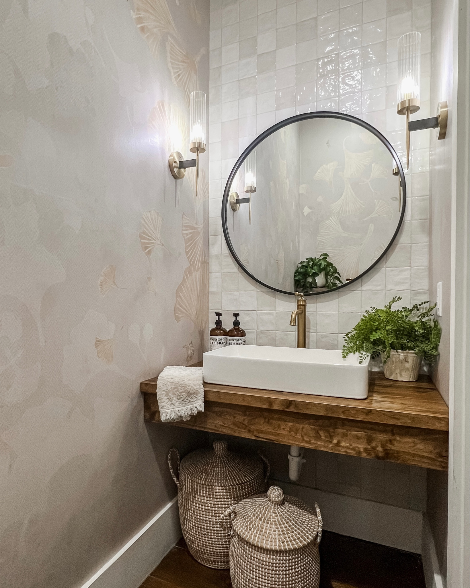 Half bathroom powder room sink vessel faucet gold light fixtures wall sconces vanity lighting amber glass soap bottles dispensers button fern lidded baskets Serena and Lily large round mirror in black and gold! Amazon target world market

#LTKhome #LTKFind #LTKstyletip