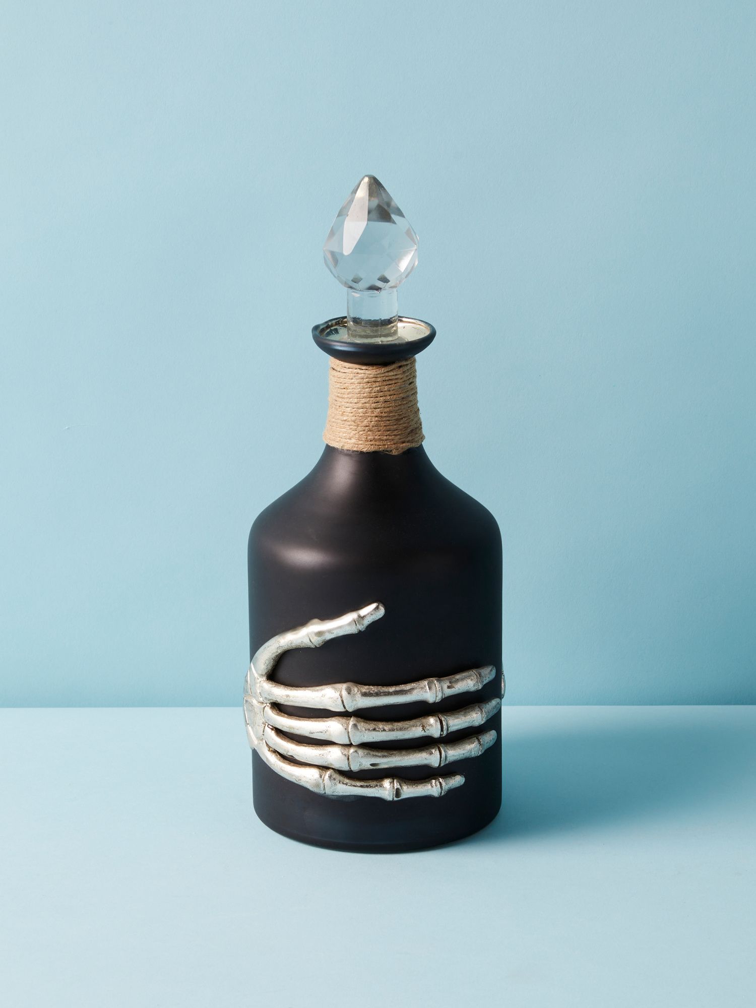 4x11 Glass Bottle With Skeleton Hands | HomeGoods