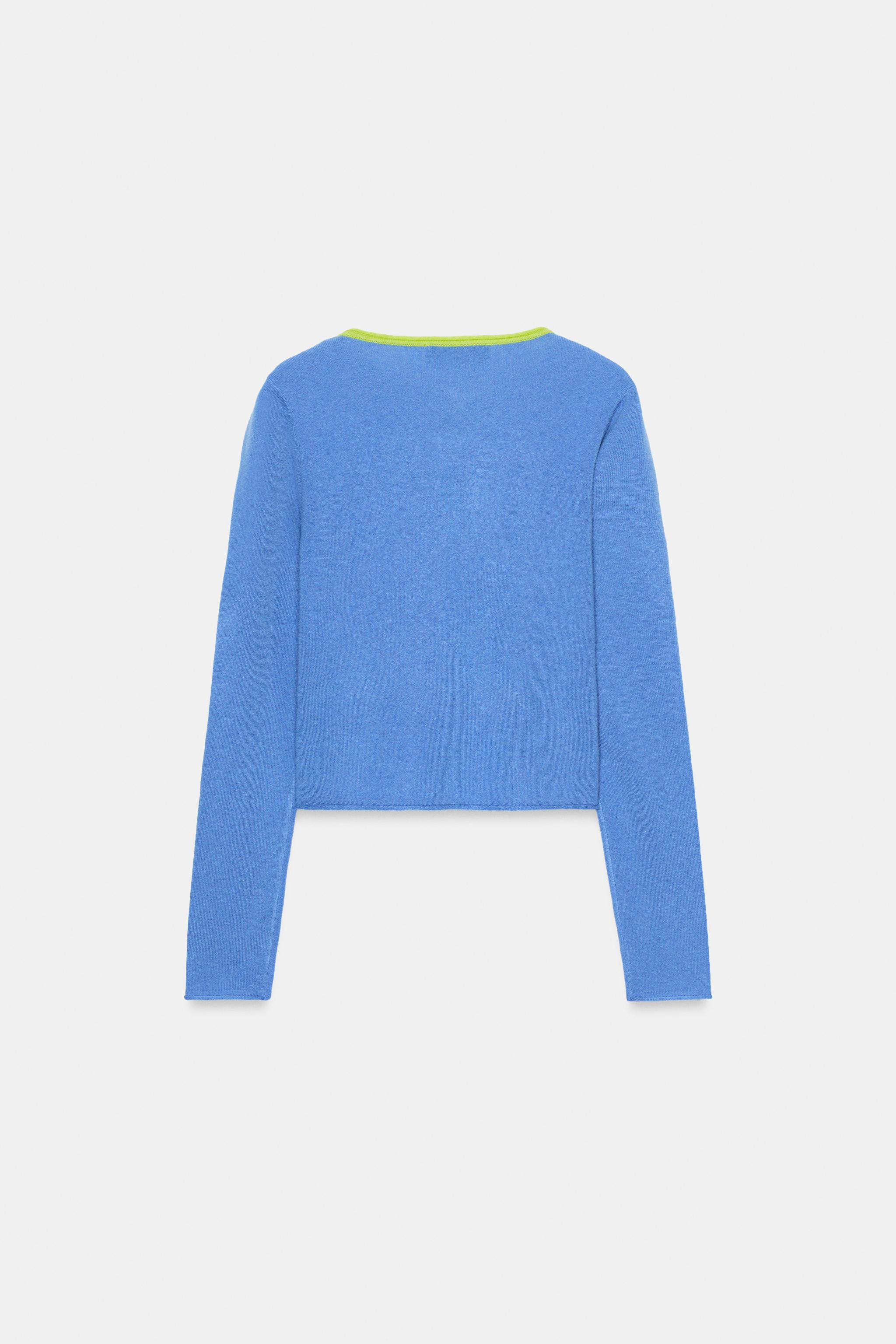 Round neck, long sleeve jacket. Contrast trim. Front button wrap closure. | Zara US