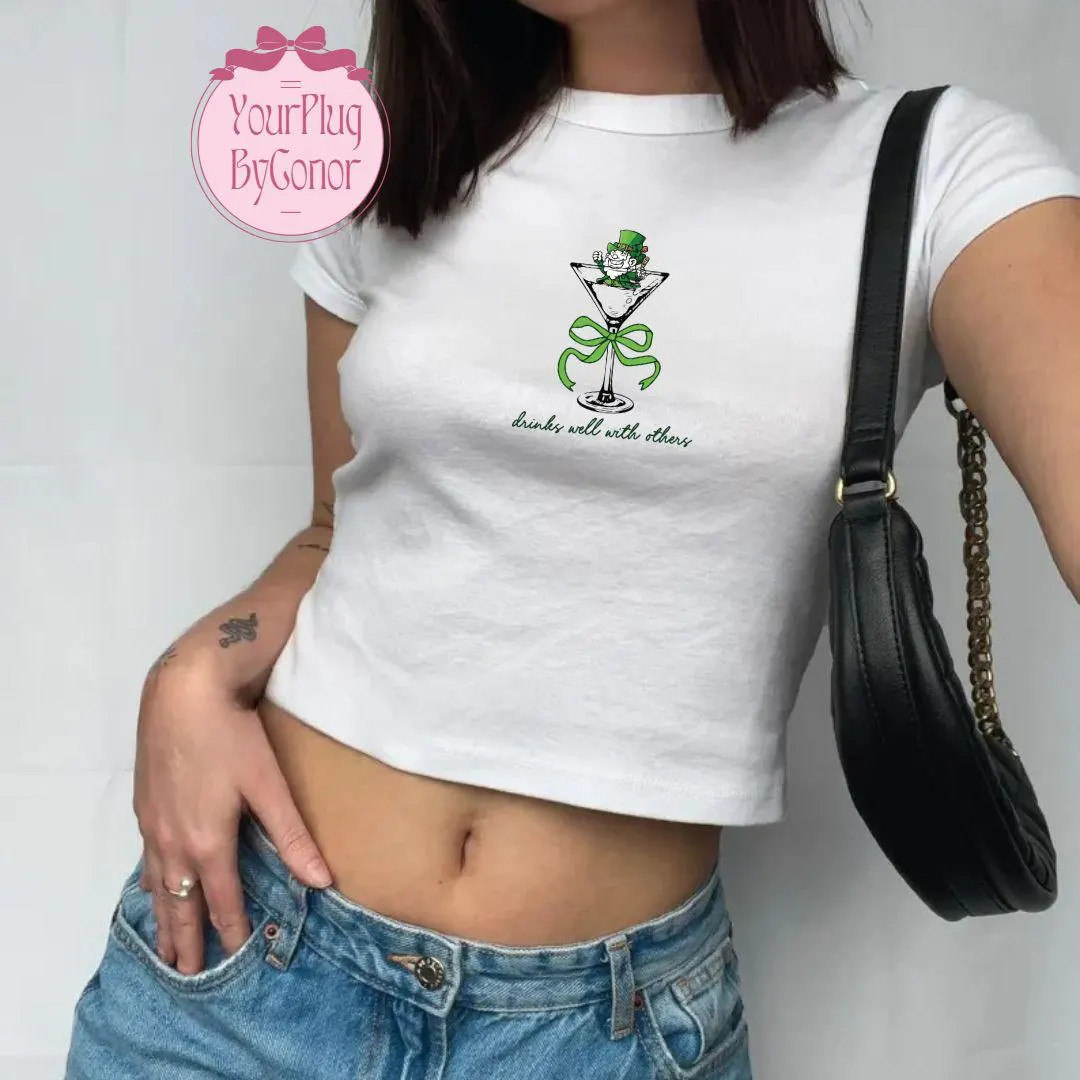 St Patrick's Day Coquette Bow Baby Tee for Women, Leprechaun Cocktail Drinks Well With Others Bab... | Etsy (US)