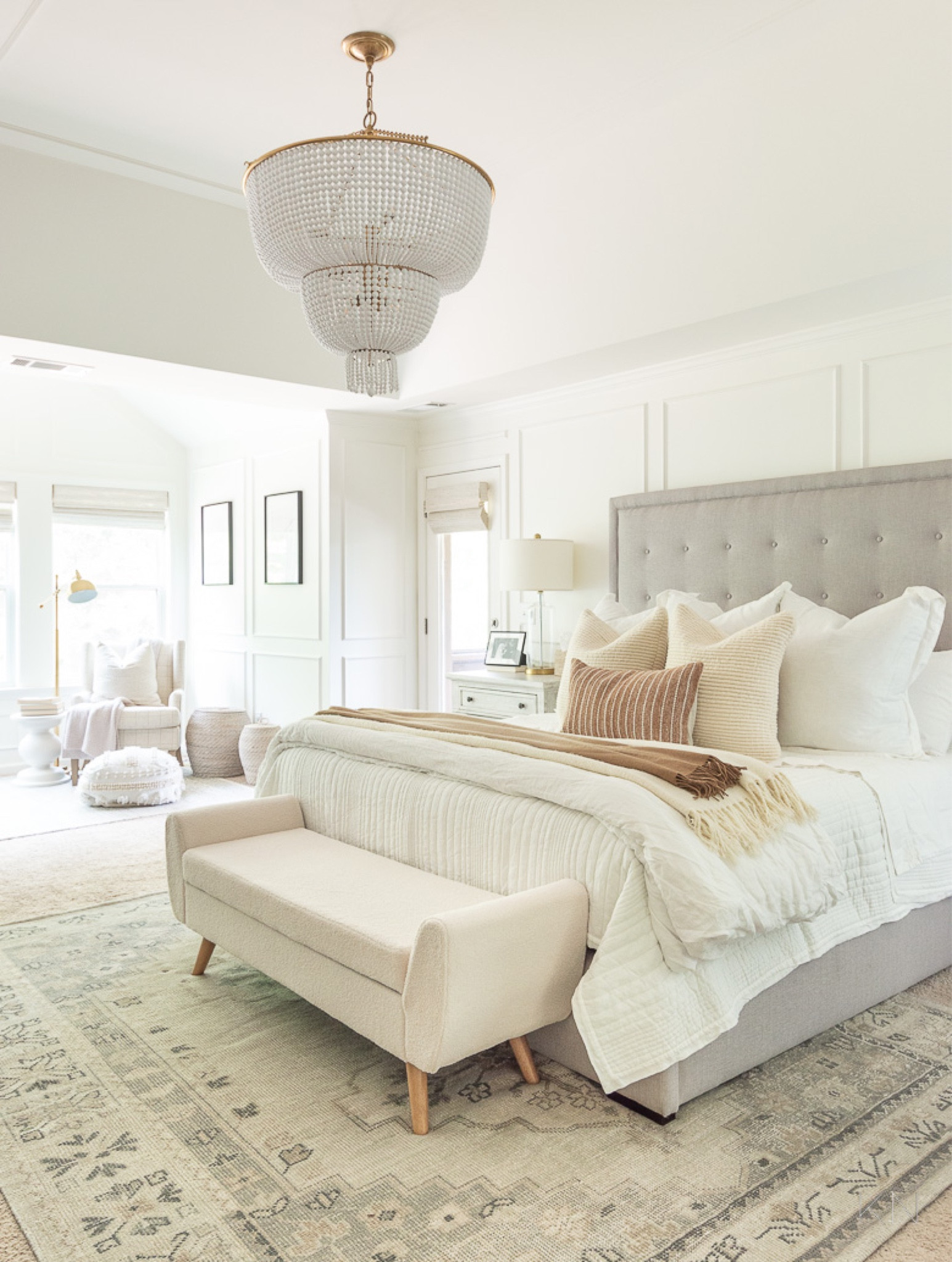 My neutral bedroom is dressed perfectly for the season with white bedding and warm accents provided by the woven pillows and layered cozy throws. home decor bedroom decor platform bed beaded chandelier neutral rug Sherpa storage bench glass lamp bedroom suite

#LTKhome #LTKstyletip