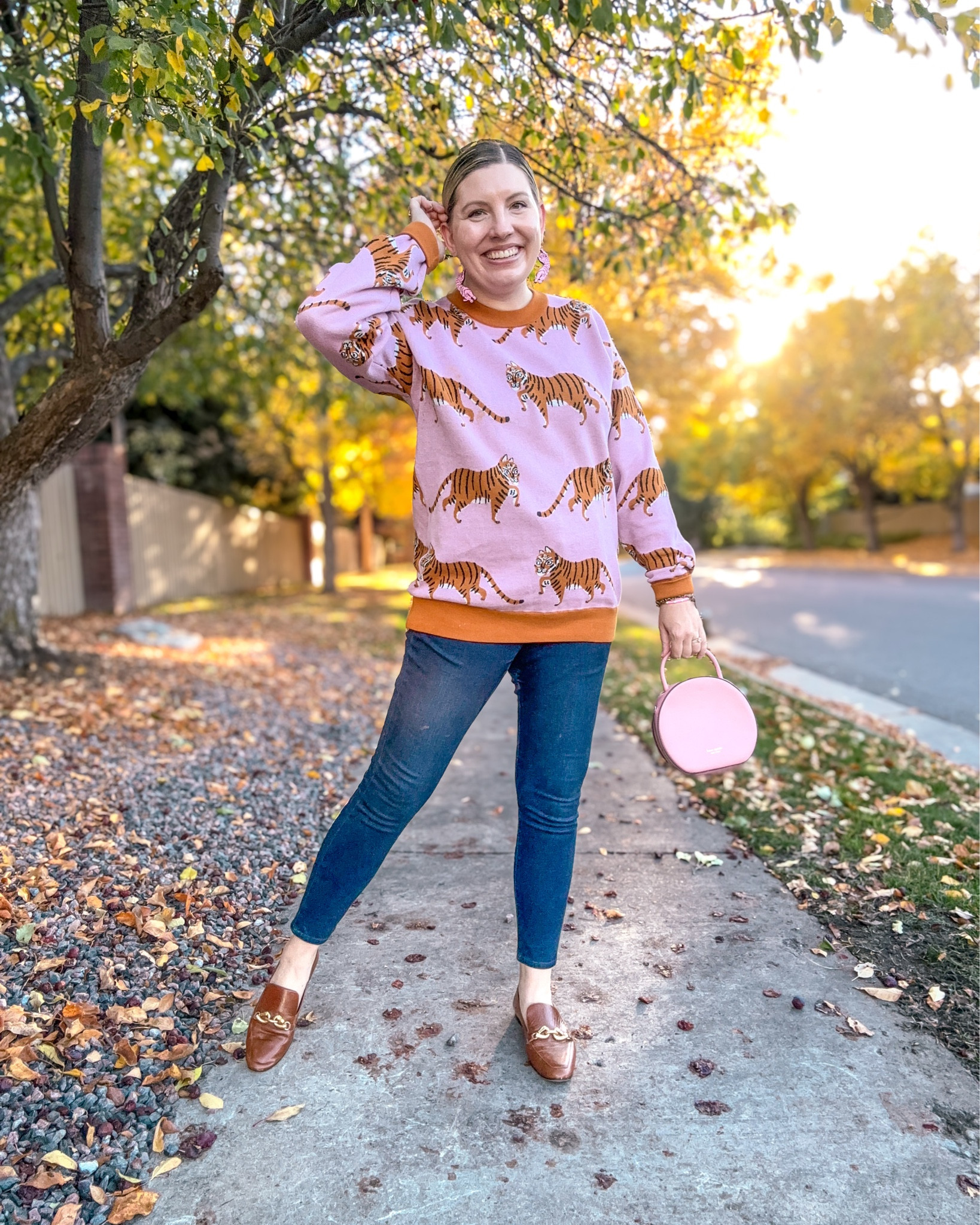 Look 9 - Heritage Hall 🐎 
A curated capsule series

I think I’ve officially entered my tiger era. 🐅 I’ve been outfitting Little One in little sweatshirts and PJs with tigers lately because they’re just so cute - so when I spotted this handmade tiger sweater for grown-ups, I knew that I had to have one! It’s cozy, beautifully made, and totally worth the price in my opinion. The knit is lovely, the quality is fantastic, and I’d say it runs a bit roomy - kind of that unisex fit - but I stuck with my usual size and love the slightly oversized feel. 🧡

This look is part of Heritage Hall, my current capsule series - a two-week curated wardrobe blending classic prep with whimsical autumn touches. Each capsule is designed around a distinct mood or theme, bringing a sense of story and creativity to getting dressed. 🍂✨

Sweater - Etsy (linked)
Earrings - Le Chic Miami (linked)
Jeans - Express (similar linked)
Loafers - Tory Burch (similar linked)
Bag - Kate Spade (linked, 2nd hand)
Bracelets - Rocksbox & Oscar de la Renta 
Ring - Rocksbox


#LTKSeasonal #LTKSaleAlert #LTKStyleTip