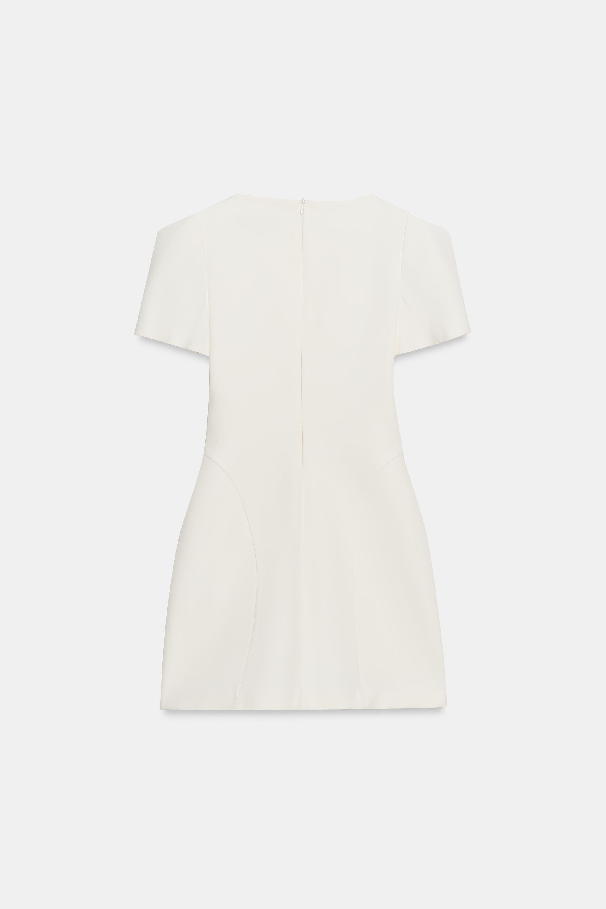 Model height: 179 cmShort-sleeved mini dress with a round neck and pleat detail. Featuring pronou... | Zara UK