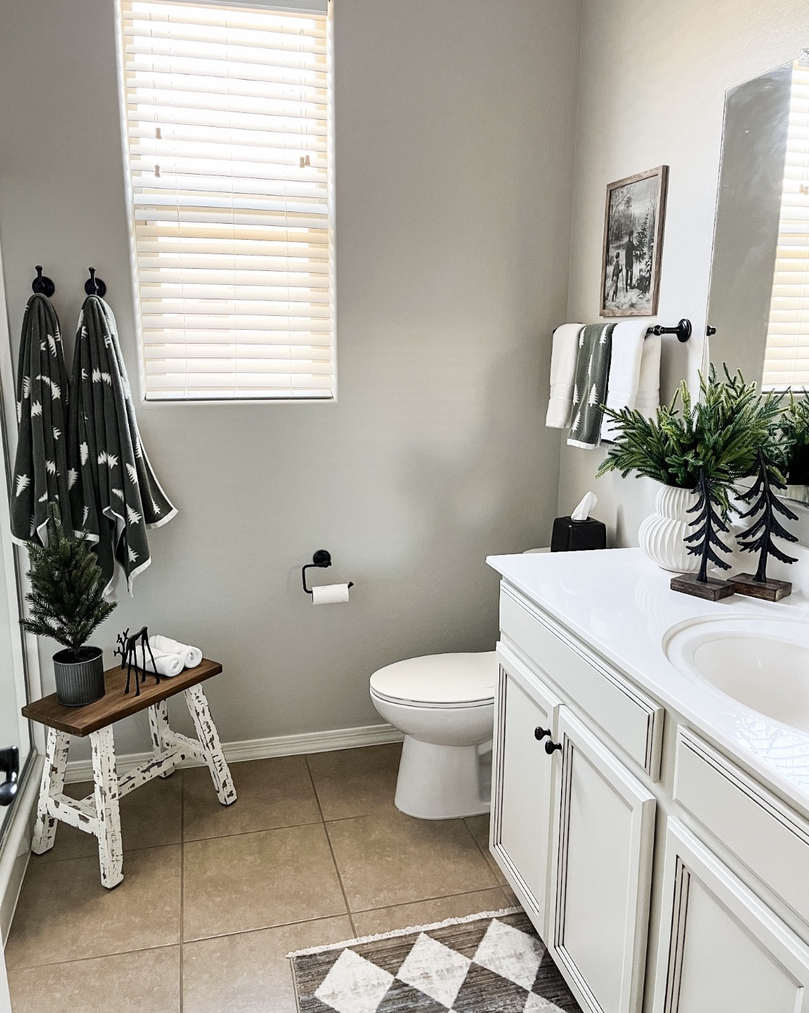 Holiday bathroom refresh!  Follow @lifeinmyarizonahome on Instagram for more holiday ideas and inspiration. 

I absolutely love these reversible tree towels, they give off the perfect winter vibe that can be used all the way until January. 
I love how adding seasonal towels, a few stems, and some inexpensive artwork, can help add to the holiday cheer!
The art is a digital download in the 11x14 size that I had printed at Walgreens. 

Pine Tree Reversible Jacquard Towel | Norfolk stems | digital download art | bench | iron deer | iron trees | Ceramic Sandy Glaze Vase | ceramic houses | canisters 


#LTKSeasonal #LTKHoliday #LTKHome