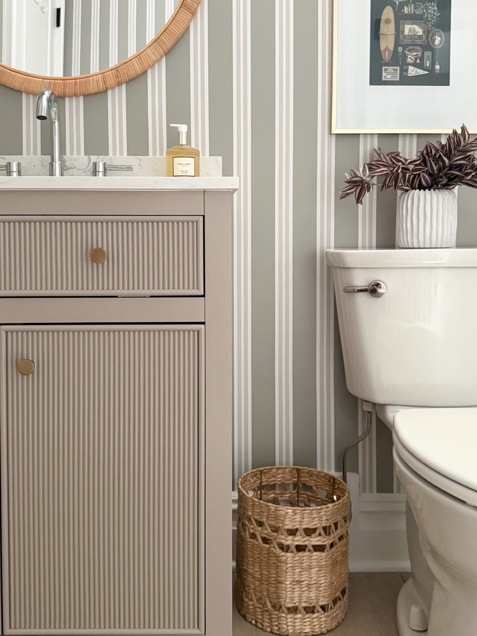 This powder room vanity area is the perfect mix of function and style. The fluted vanity, woven storage basket, striped wallpaper, and simple decor details create a space that feels fresh, classic, and thoughtfully designed.

powder room decor, bathroom vanity ideas, fluted vanity, bathroom storage ideas, striped wallpaper, woven basket, small bathroom design, bathroom makeover, coastal bathroom decor, timeless home design, neutral bathroom ideas, girlonthehudson

#LTKdayinmylife #LTKSeasonal #LTKHome