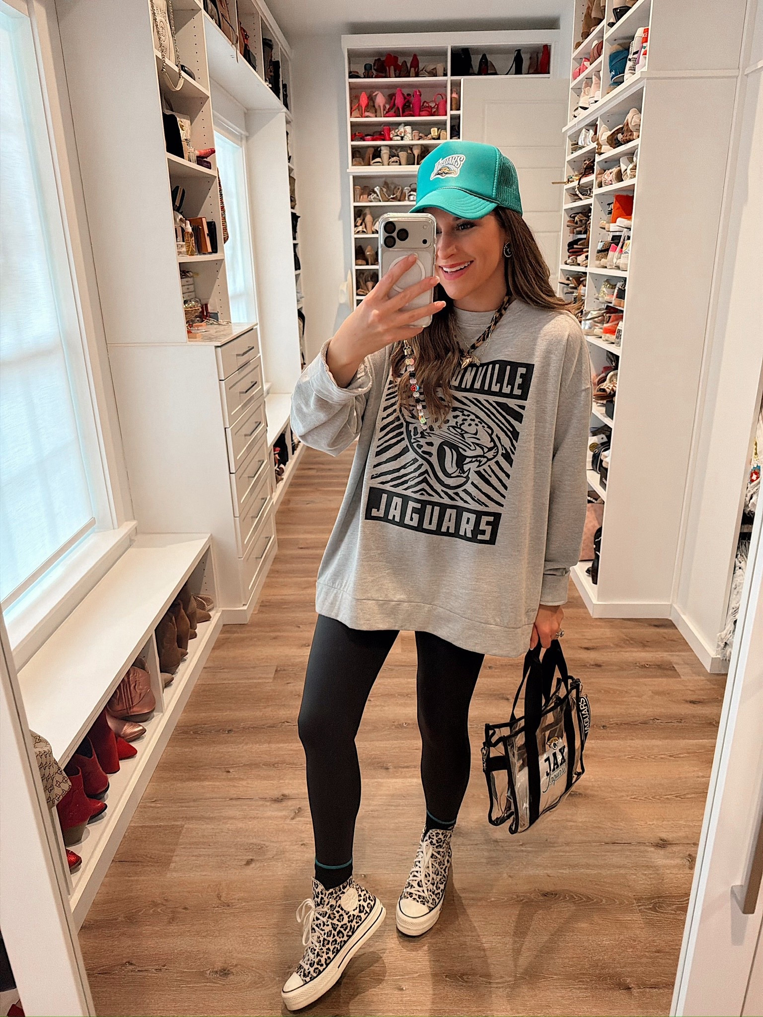 Rainy NFL football game day ootd! Jacksonville Jaguars game day look! Xl sweatshirt and small leggings - fits tts.

#LTKFindsUnder50 #LTKSeasonal #LTKootd