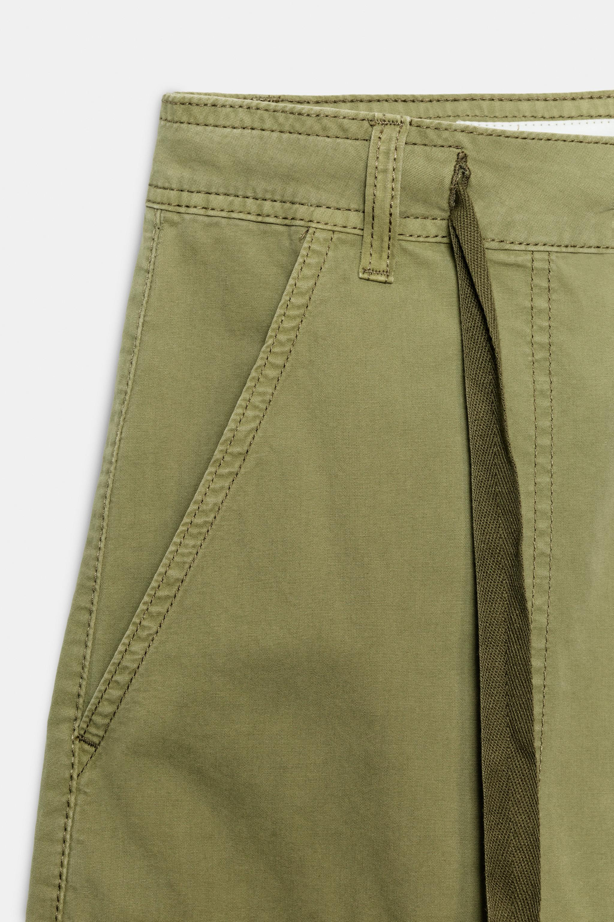 Model height: 181 cmMid-waist trousers with belt loops and adjustable ties. Patch pockets on the ... | Zara UK
