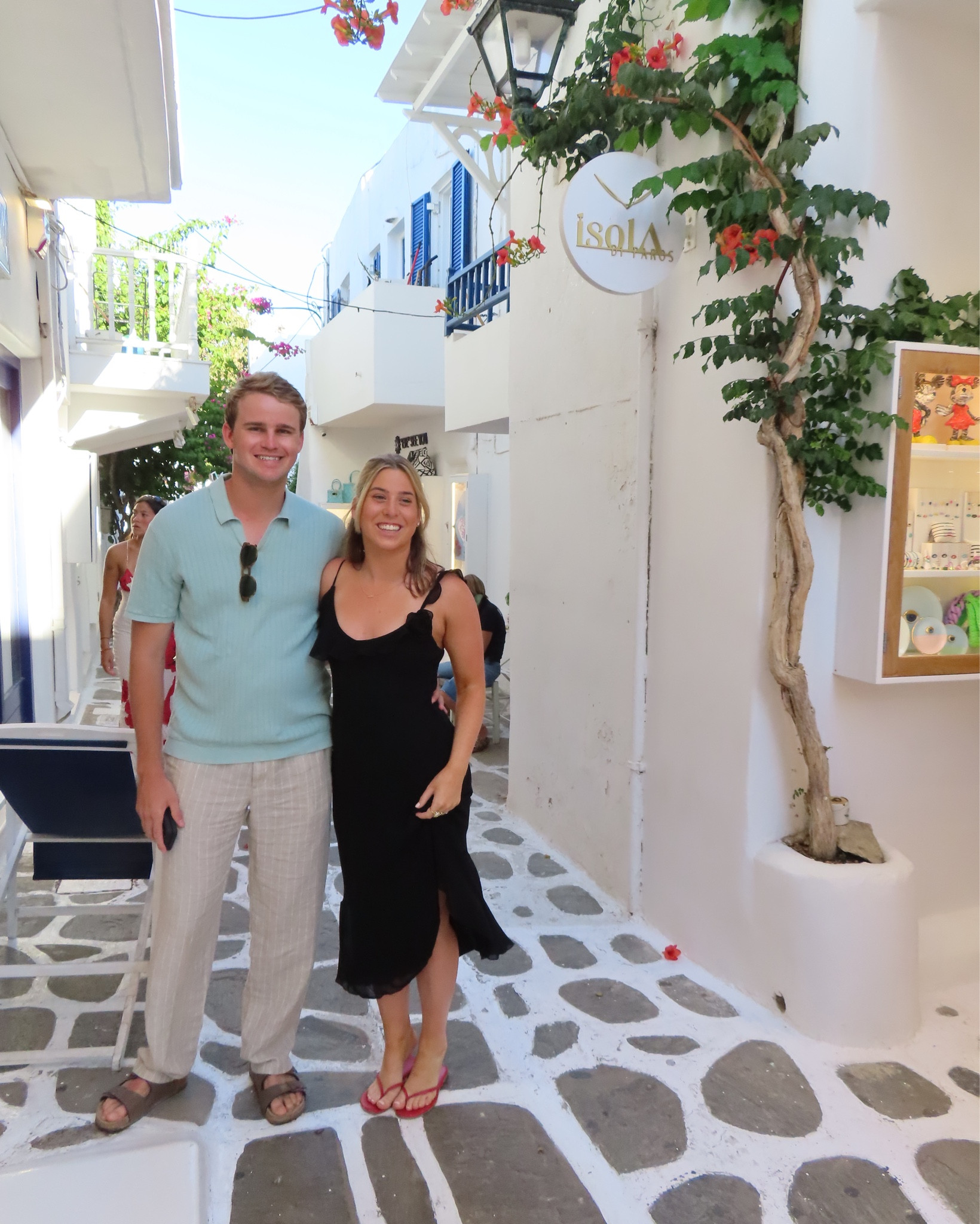 Black midi dress with floral and ruffle details - aritzia dress. Perfect for European summer and transition to fall! Work in Paros Greece. 

#LTKTravel #LTKFallSale #LTKFindsUnder100