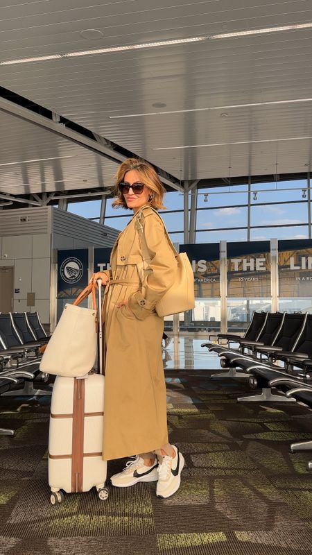 Airport outfit - cozy set tts layered w an oversized trench coat. Nike under $80

#LTKtravel #LTKfindsunder100 #LTKstyletip