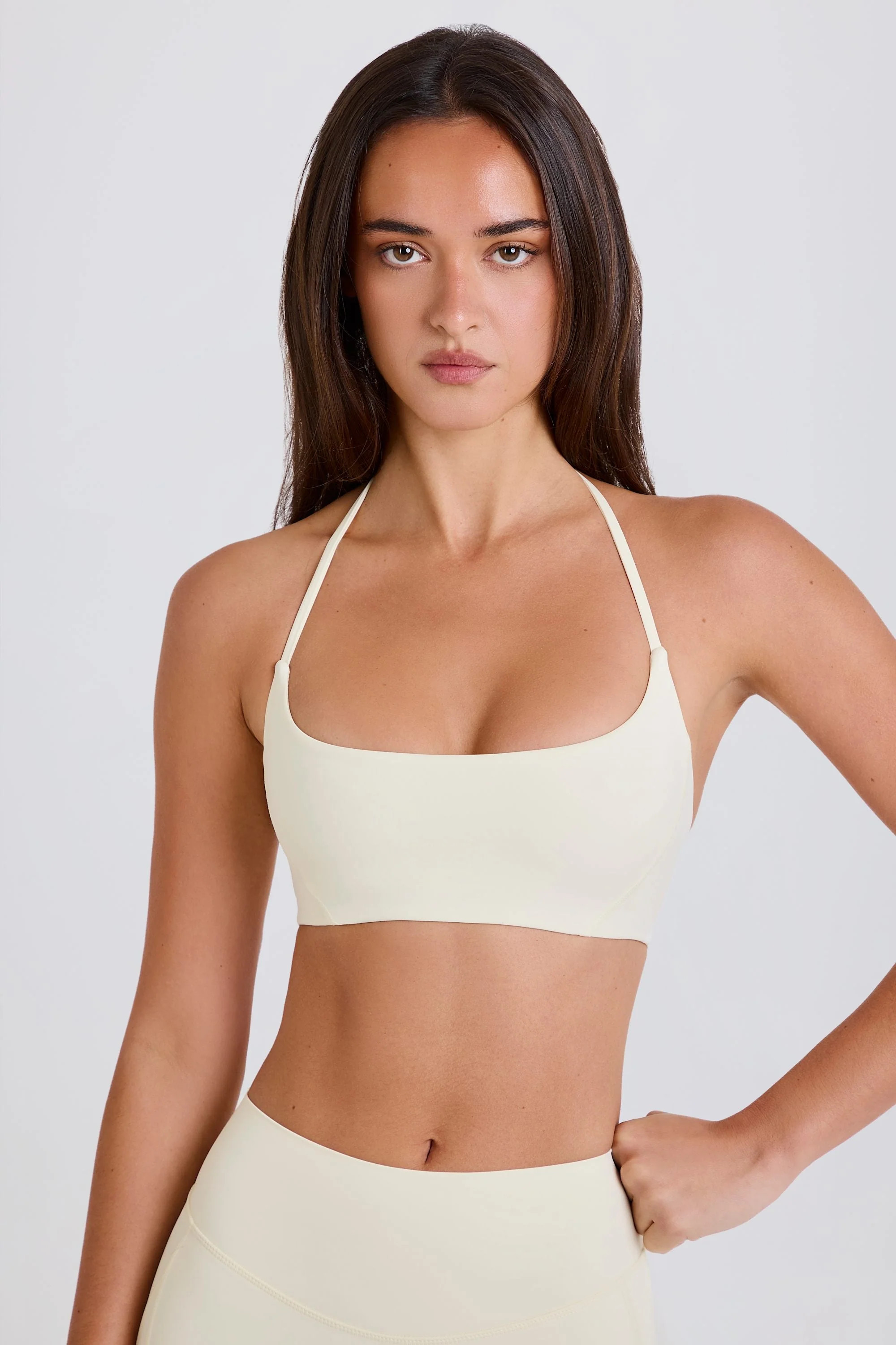 Four-Way Stretch Scoop-Neck Halterneck Sports Bra in Cream | Oh Polly