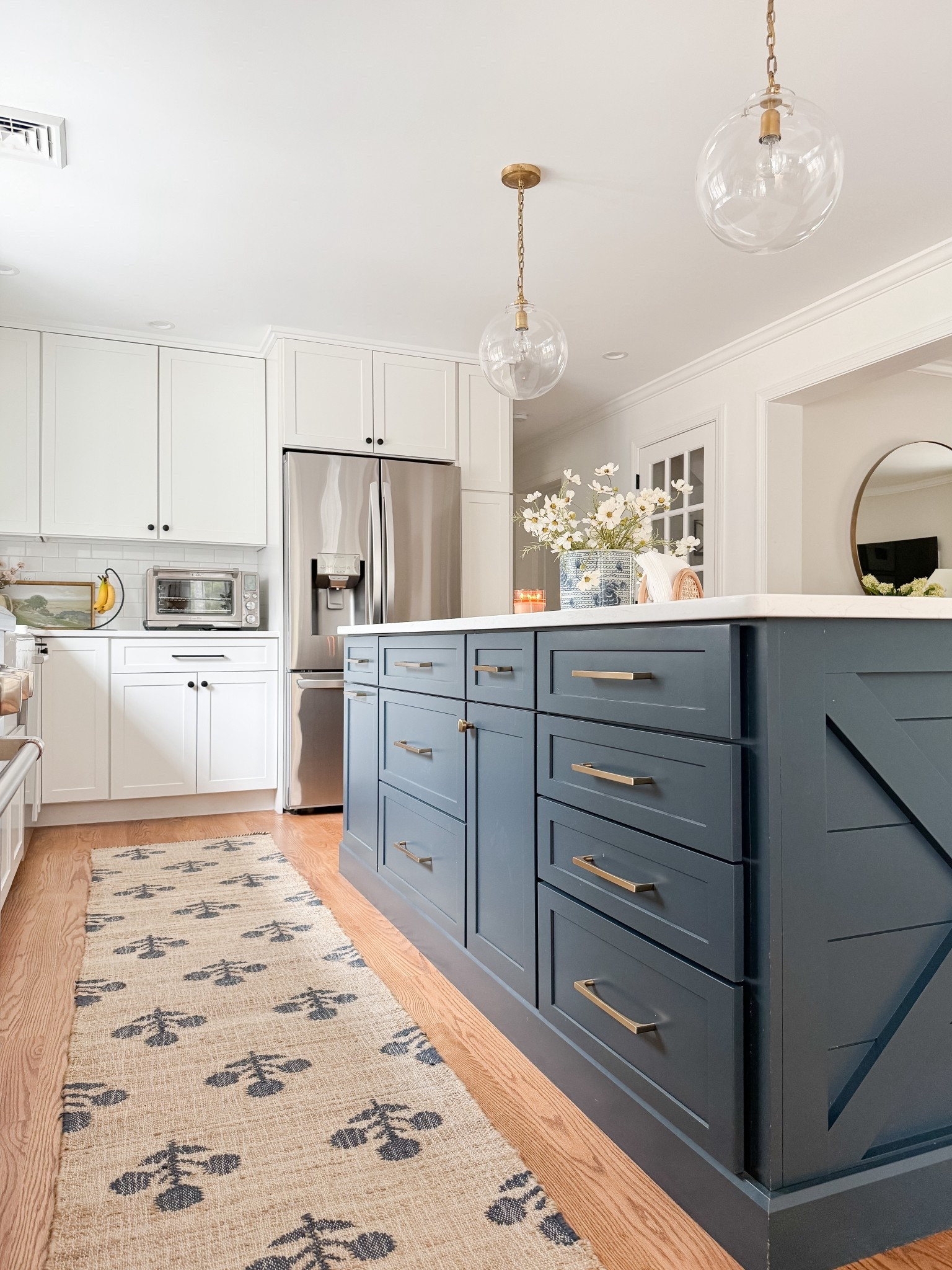Coastal kitchen styled with navy island, white cabinets, neutral runner rug, and simple kitchen decor for a light and layered coastal space.

coastal kitchen decor, navy kitchen island, neutral kitchen runner rug, white cabinet kitchen, coastal kitchen styling, neutral kitchen decor, light coastal kitchen design, kitchen island runner rug, sherricalnanhome

#LTKHome