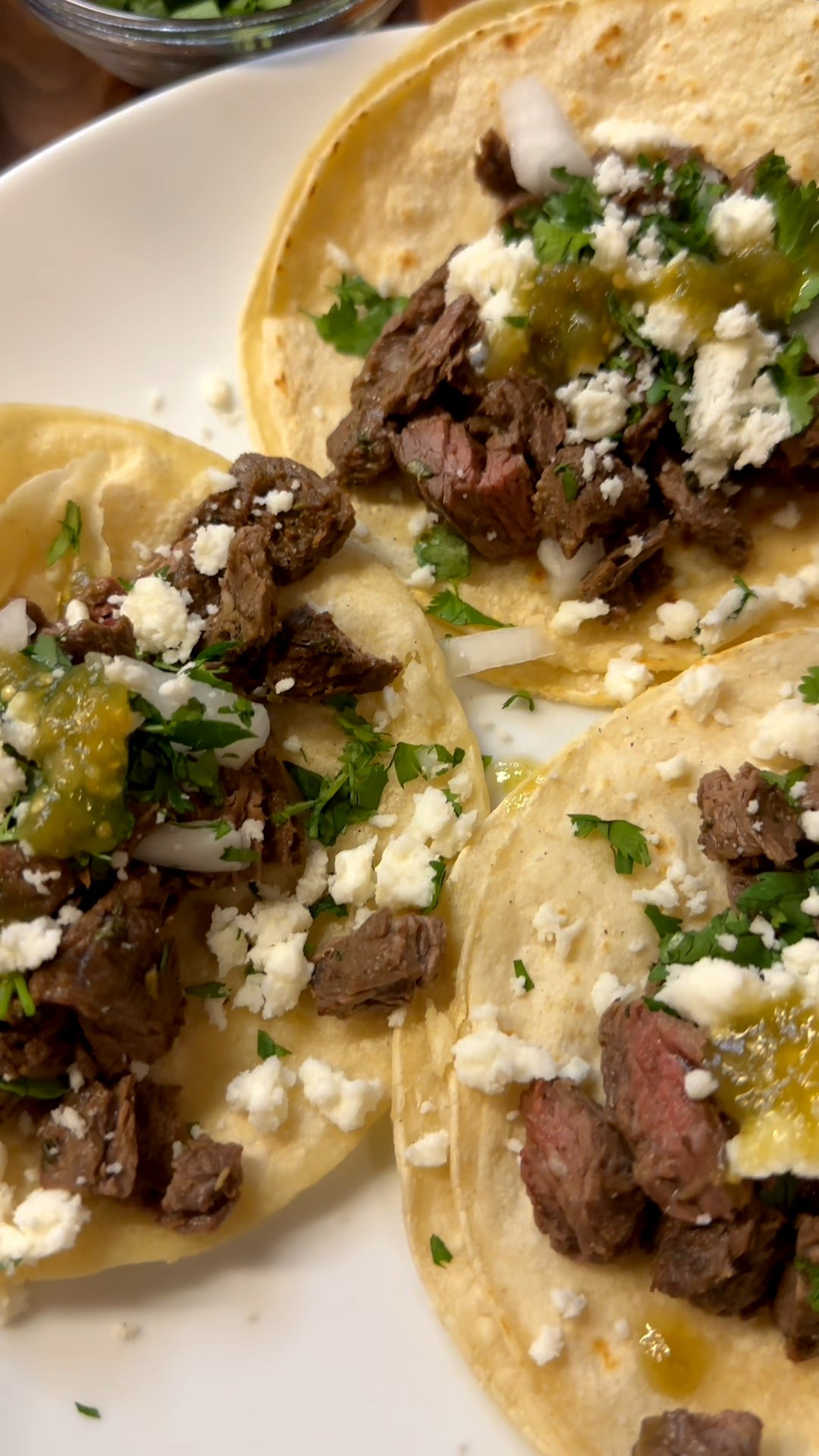 Let’s grill up some carne asada tacos!

First, marinate your skirt steak with my carne asada marinade:

Juice of 2-3 limes
Juice of 1 orange
1/2 of seeded jalapeno, diced
1/2 cup of freshly chopped parsley
3 garlic cloves, minced
1 tbsp white wine vinegar
2 tsp cumin
2 tsp pepper
2 tsp salt
3 tbsp olive oil

Add everything to a bowl, and mix well. Add skirt steak and marinade into a ziplock. Let marinate overnight or at least 4 hours.

Remove from fridge 30 while grill heats. Grill to perfection. Let meat rest before dicing up and serving.

Make a taco bar - warmed corn tortillas, cotija cheese, diced white onions, fresh cilantro, limes and salsa verde! Serve with rice and beans!


#LTKHome #LTKFamily