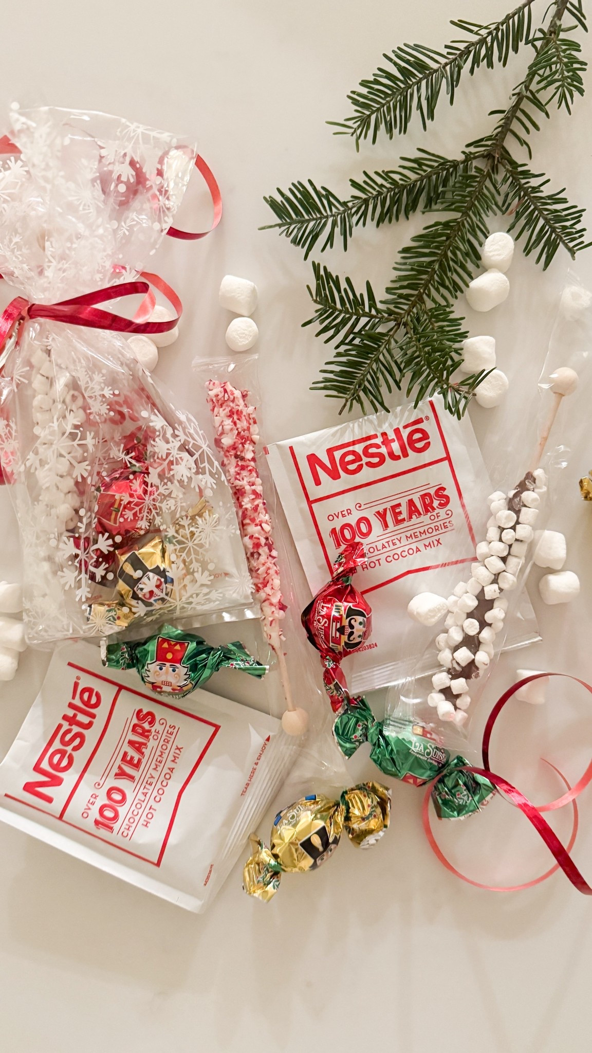 We’ve been assembling the kids’ class Christmas treats for their school Christmas Party this week.  I found these hot chocolate stirrers at HomeGoods & that was the jumping off point for some cozy little hot cocoa goody bags. ☕🎄 We added some Christmas chocolates & a package of Nestle hot cocoa to the stirrers. The Christmas chocolates came from HomeGoods and the snowflake bags and ribbon from Hobby Lobby, but I’ll link some similar options below if you want to put together your own sweet treats. Another easy option in lieu of hot chocolate stirrers is a candy cane  

#LTKSeasonal #LTKKids #LTKHoliday