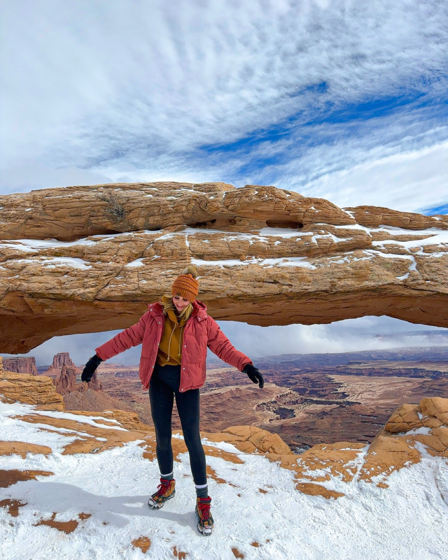 Moab arch in the snow-staying cozy while hiking