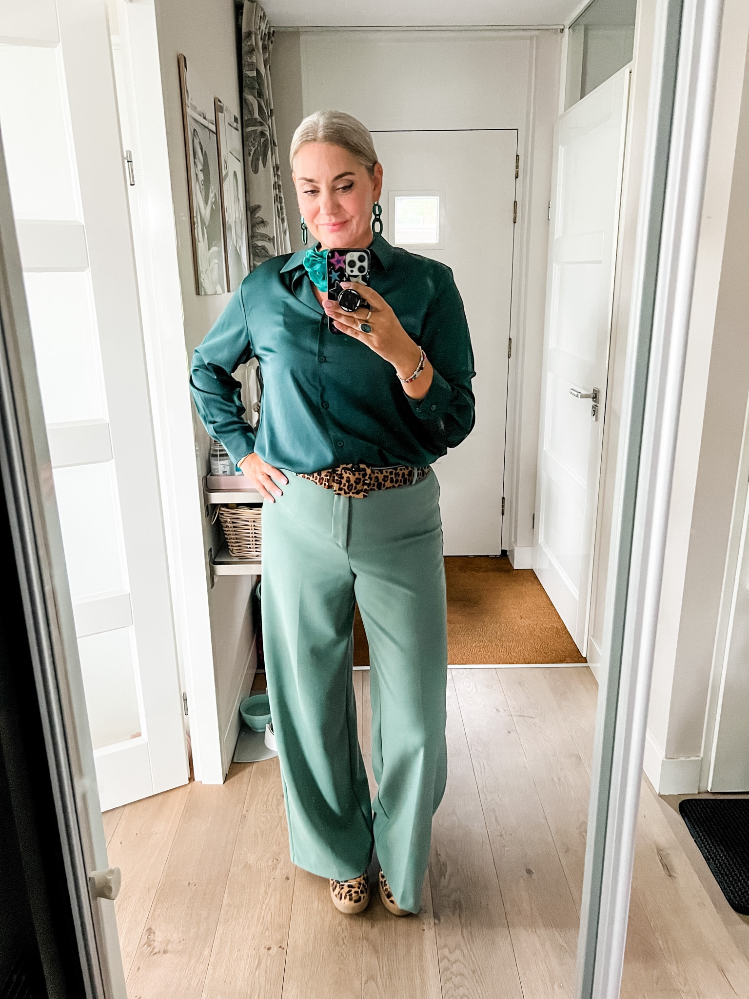 Ootd - Tuesday. The prettiest satin shirt in beautiful bottle green paired with a pair of old Zara trousers, leopard belt, leopard sneakers and a floral choker. 



#LTKeurope #LTKstyletip #LTKworkwear