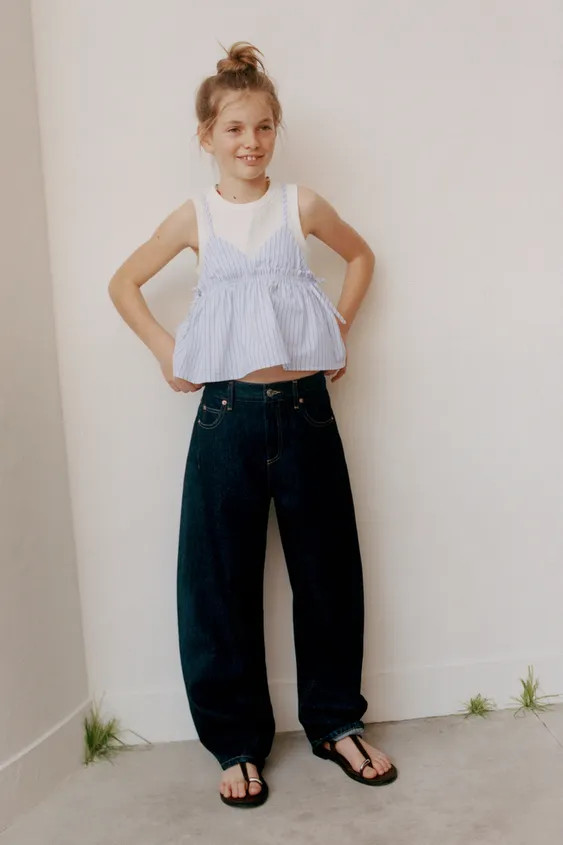 V-neck top with straps. Featuring bows on the sides and a stripe print. Inner ribbed T-shirt with... | Zara UK