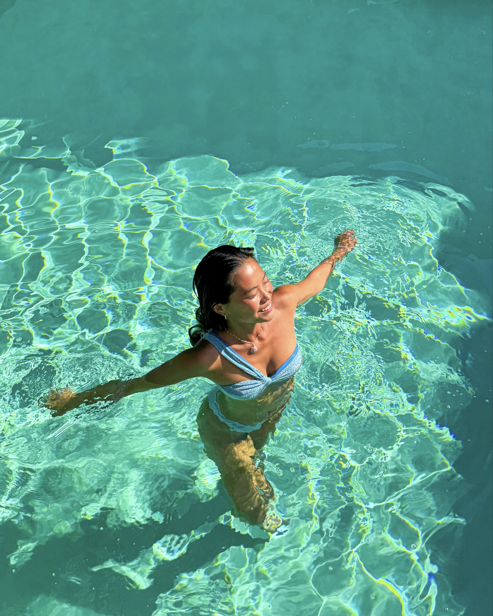 sparkly blue swimsuit, wearing a size xs in top and bottom, one shoulder strap top, shimmer bikinii