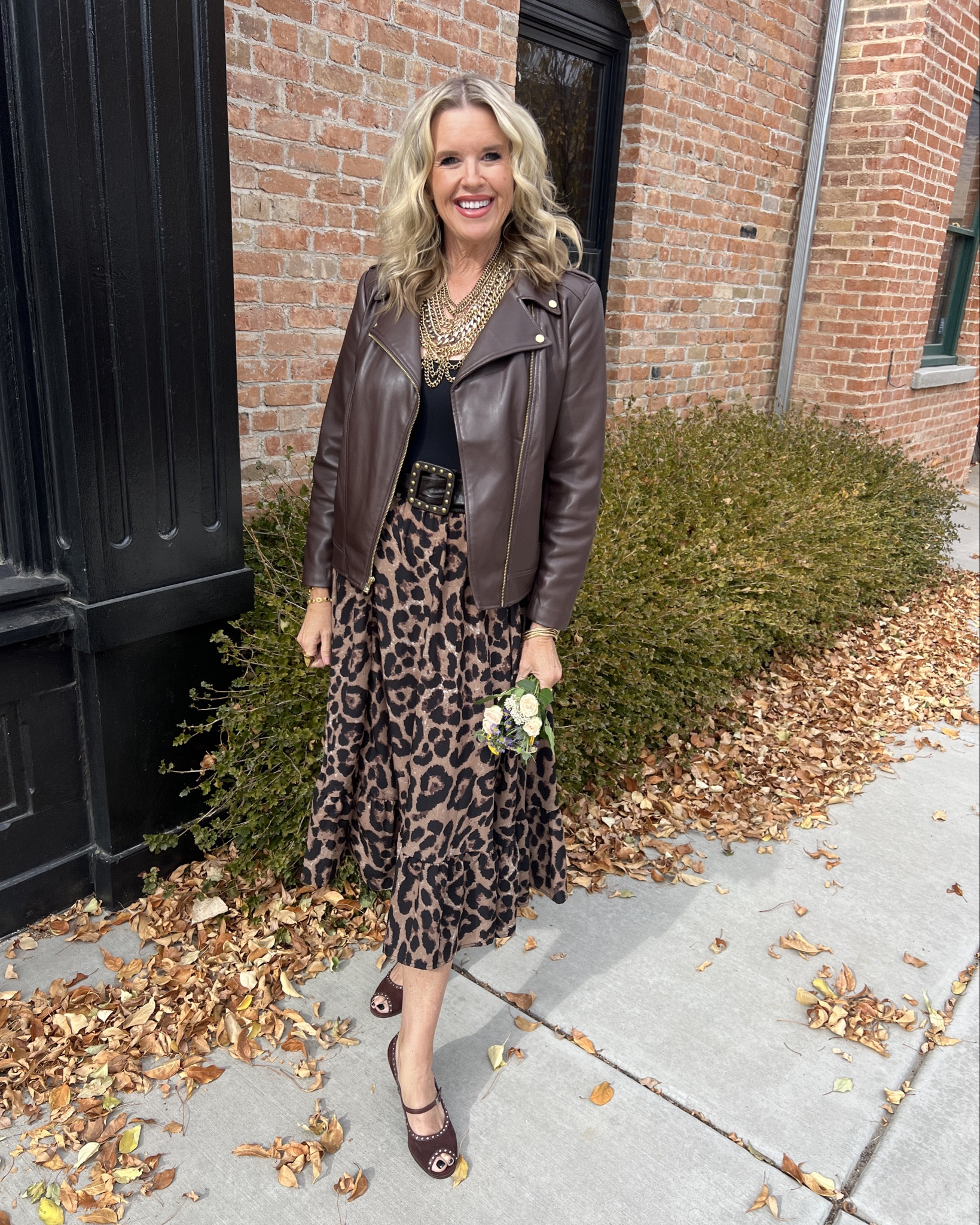 #ootd 
Way to wear leopard skirt

Amazon find leopard skirt fits tts

Black Pumiey bodysuit tts 

Chocolate faux leather jacket fits tts 

Vintage suede Mary Jane heels with side details 

Multi chain statement  necklace 

Wide chock belt with studs 

Julie Vos earring, bracelets and ring 