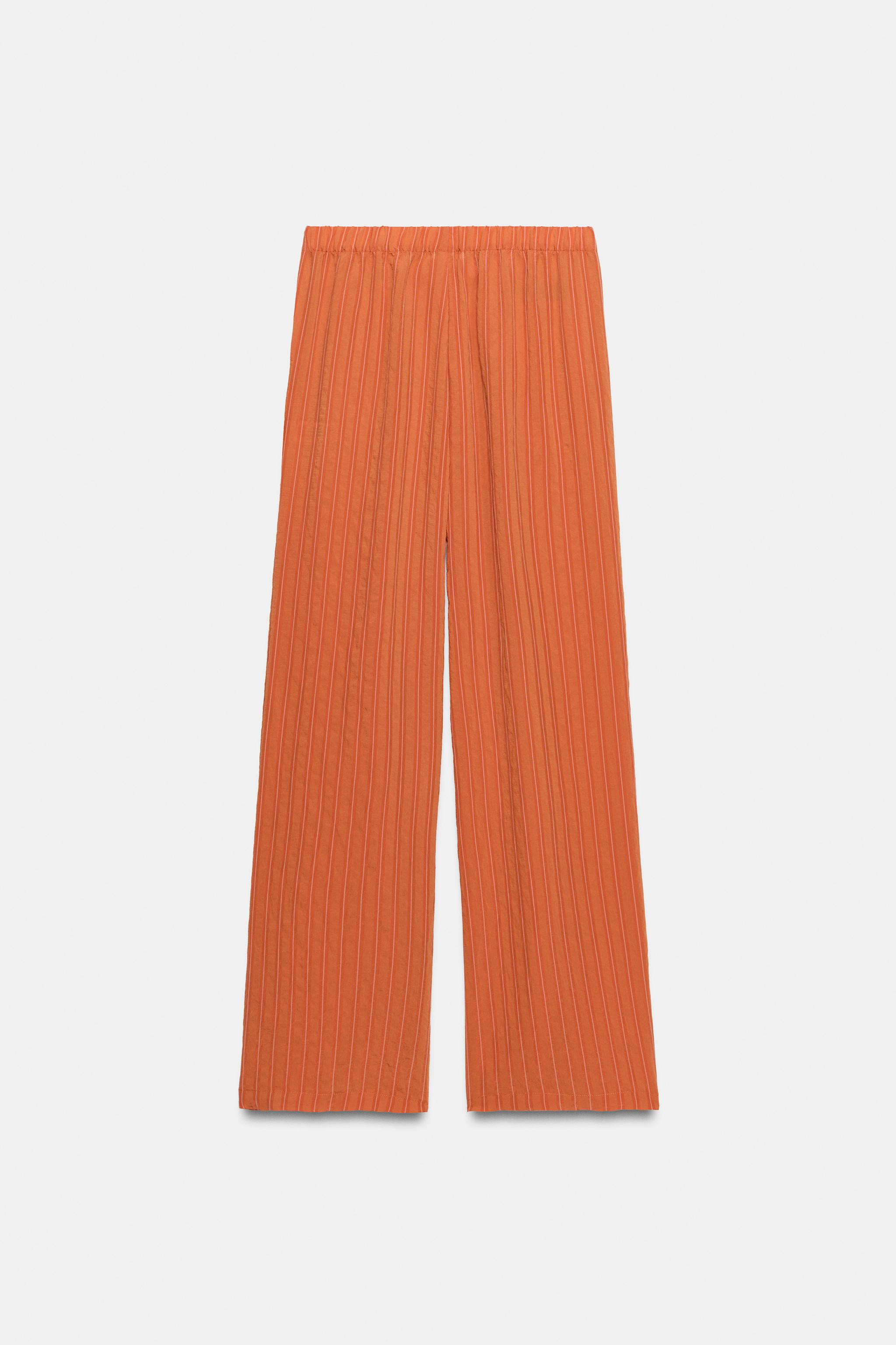 Mid-rise pants with an elastic waistband. Side pockets. | Zara US