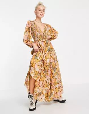 ASOS DESIGN shirred wrap tiered skirt maxi dress in mustard floral print | ASOS (Global)