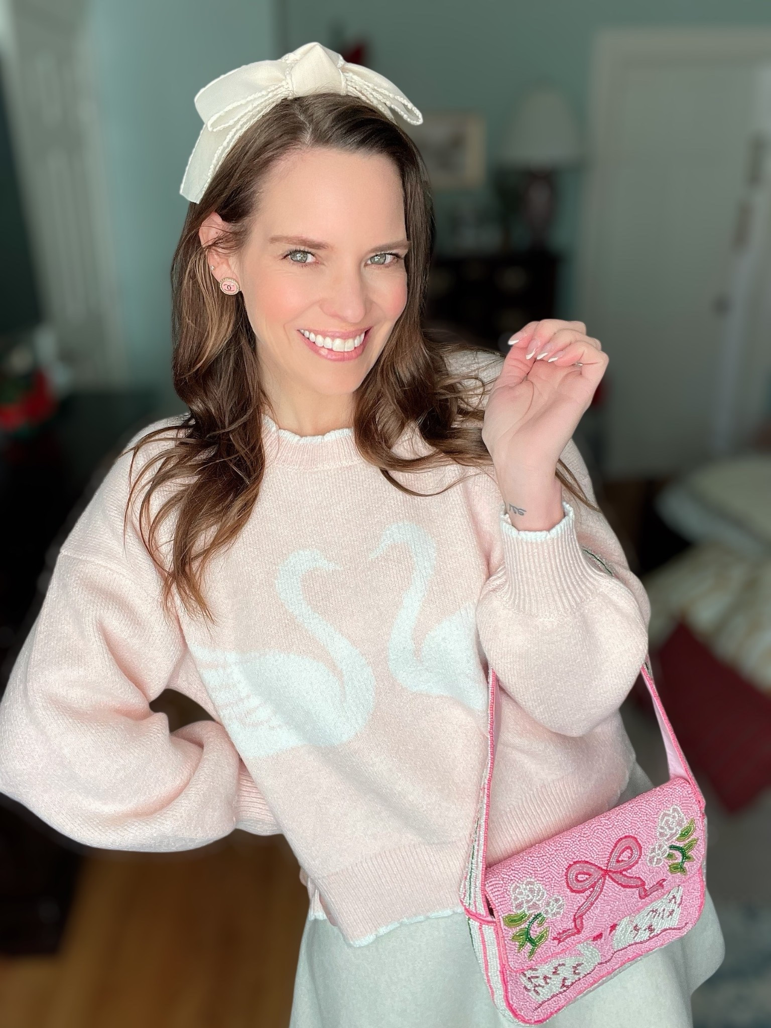 Pretty in Pink Swan Sweater Outfit 🦢✨

This outfit is giving sweet, feminine, and cozy all at once 💕 The scalloped swan sweater is such a standout and feels so much more expensive than it is. I styled it with a soft mini sweater skirt for an easy, polished look that’s still comfortable and wearable. The bow headband adds the prettiest finishing touch, and the pink ballet flats tie everything together perfectly 🩰💗

The completely beaded swan shoulder bag is the star accessory here — so detailed, playful, and full of charm. It adds texture and makes the whole outfit feel extra special without being over the top 🎀✨ I’m also wearing a knee brace after fracturing my fibula head, which is a reminder that you can still feel cute while prioritizing comfort and support 🤍

Pink sweater outfit, swan sweater outfit, beaded handbag, bow headband style, ballet flats outfit, feminine winter outfit, cute casual outfit ideas, affordable boutique finds, Target skirt outfit, cozy chic style

#LTKGiftGuide #LTKHoliday #LTKFindsUnder50

#LTKFindsUnder50 #LTKHoliday #LTKGiftGuide