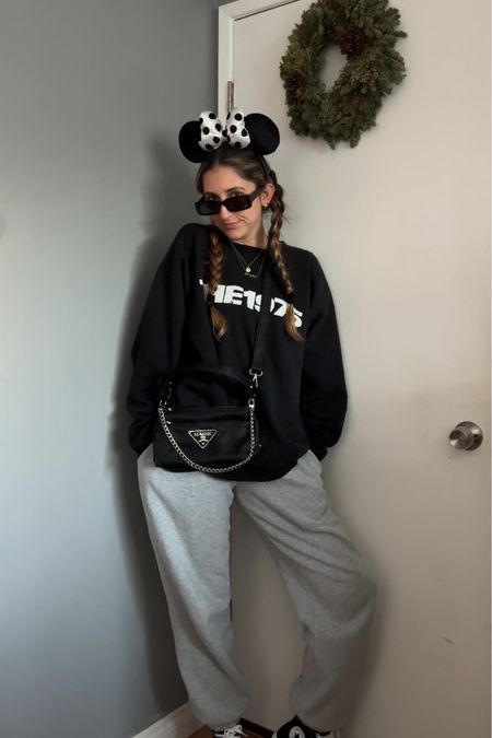 Another fitmas look 🖤

Ears: Disneyland/Shop Disney (linked on ebay)
Sunglasses: Curl Surf
Crewneck: The 1975 merch
Sweatpants: Brandy Melville 
Bag: n&ndesigns (Etsy)
Shoes: Converse

Ig: @jkyinthesky & @jillianybarra
TikTok: @jill.ybarra

#disneystyle #disneyaesthetic #disneyoutfit #disneyoutfits #disneyootd #comfystyle #casualstyle #thatdisneygirl #disneyoutfitinspo #disneyblogger 

#LTKstyletip #LTKitbag #LTKfindsunder50