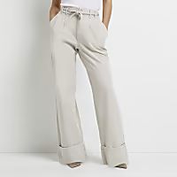 Petite cream pleated wide leg trousers | River Island (UK & IE)