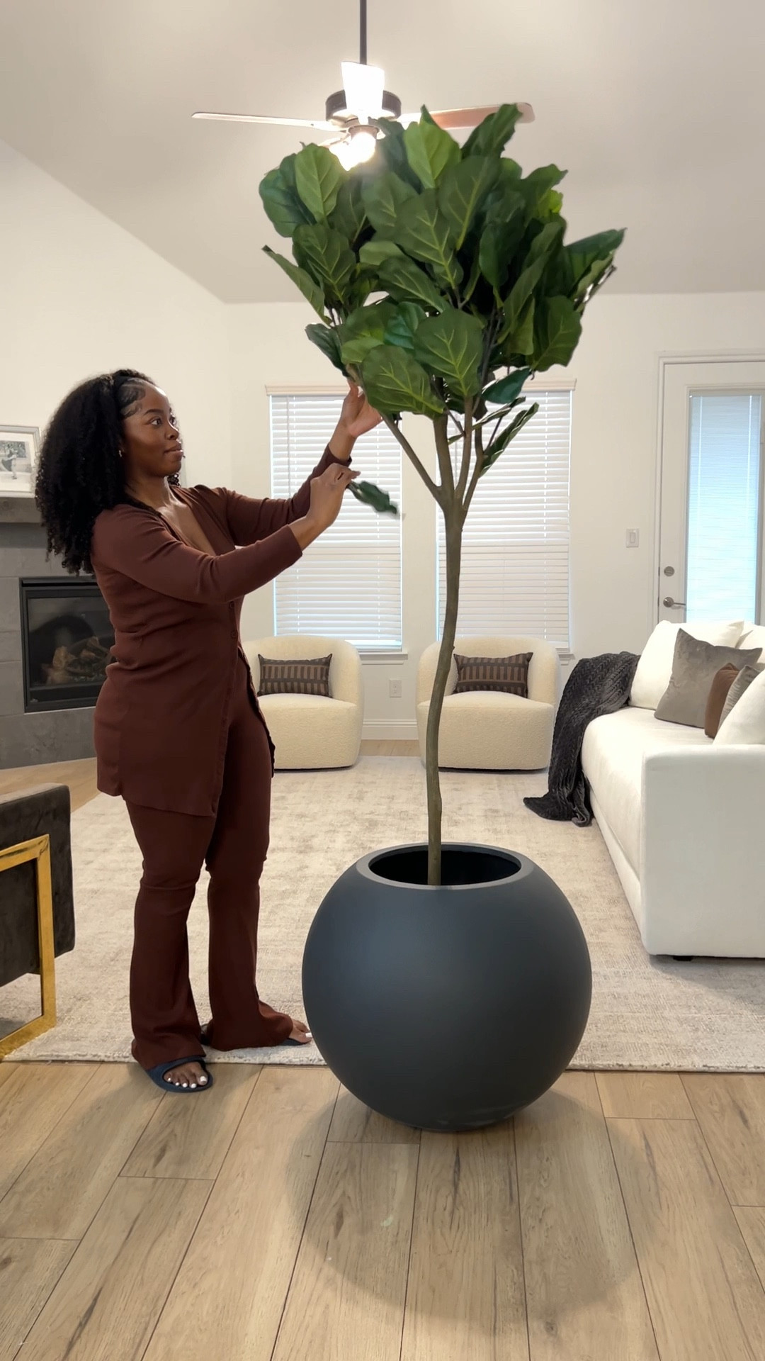 Shop this beautiful living room decor 😍 White modern sofa, with Boucle accent chairs, 12x20 lumbar pillow, faux fiddle tree (7ft) with oversized charcoal gray planter, gray and gold velvet accent chair, and glimmer pearl grey area rug (10x14) 💕