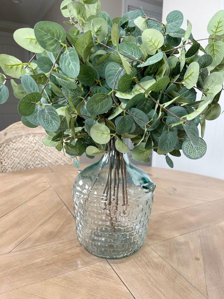 My round wood dining table and a pretty glass jug vase with faux eucalyptus! Love this dining table! #amazon #amazonhome #founditonamazon #homedecor  #fauxeucalyptus #centerpiece #tabledecor #roundtable #diningroom #diningroomdecor #home

#LTKhome
