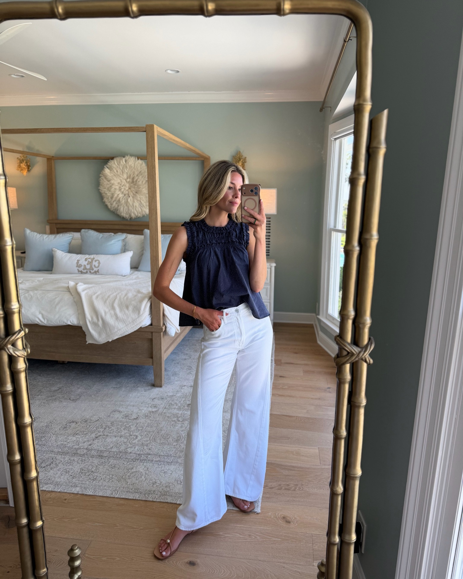 an easy summer outfit formula i’ll never get tired of: a pretty top + white denim + simple sandals 🤍 this look feels polished enough for lunch, dinner, casual meetings, or a summer weekend plan, but still effortless and easy to throw on.

love the texture and subtle detail on this smocked top paired with crisp white wide leg denim and neutral sandals. one of those combinations that feels classic, chic, and endlessly wearable all season long.

wearing size small top, size 25 jeans 

 #LTKootd #LTKSeasonal