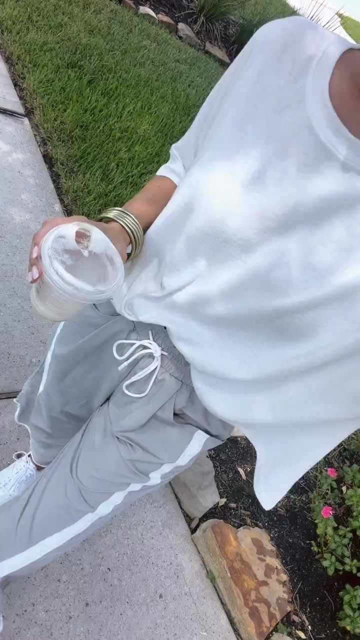 These sporty wide leg pants are exactly what I want for casual fall days. The contrast stripe and drawstring waist give them that track pant feel, and a simple white tee keeps the whole outfit light and comfortable.

wide leg track pants, striped pants, drawstring pants, sporty fall outfit, casual fall outfit, white tee outfit, comfortable pants, athleisure style, everyday fall outfit, transitional fall style, relaxed pants, HauteandHumid

#LTKootd #LTKSeasonal #LTKOver40
