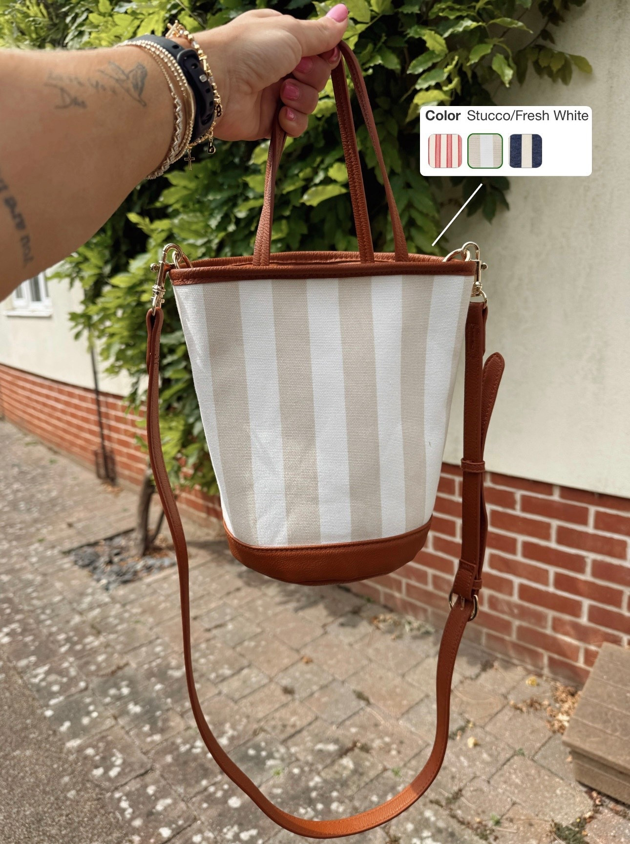 Absolutely obsessed w/ this striped bag🤎🌼 $20 bucket style, crossbody & a great size to hold a solid amount ☺️ also comes in 2 more colors! My bag of choice for our trip here in the UK! 🇬🇧

Target finds / crossbody bag / under $30 / summer style / ootd / for her / Holley Gabrielle 

#LTKSummerEdit #LTKItBag #LTKSeasonal