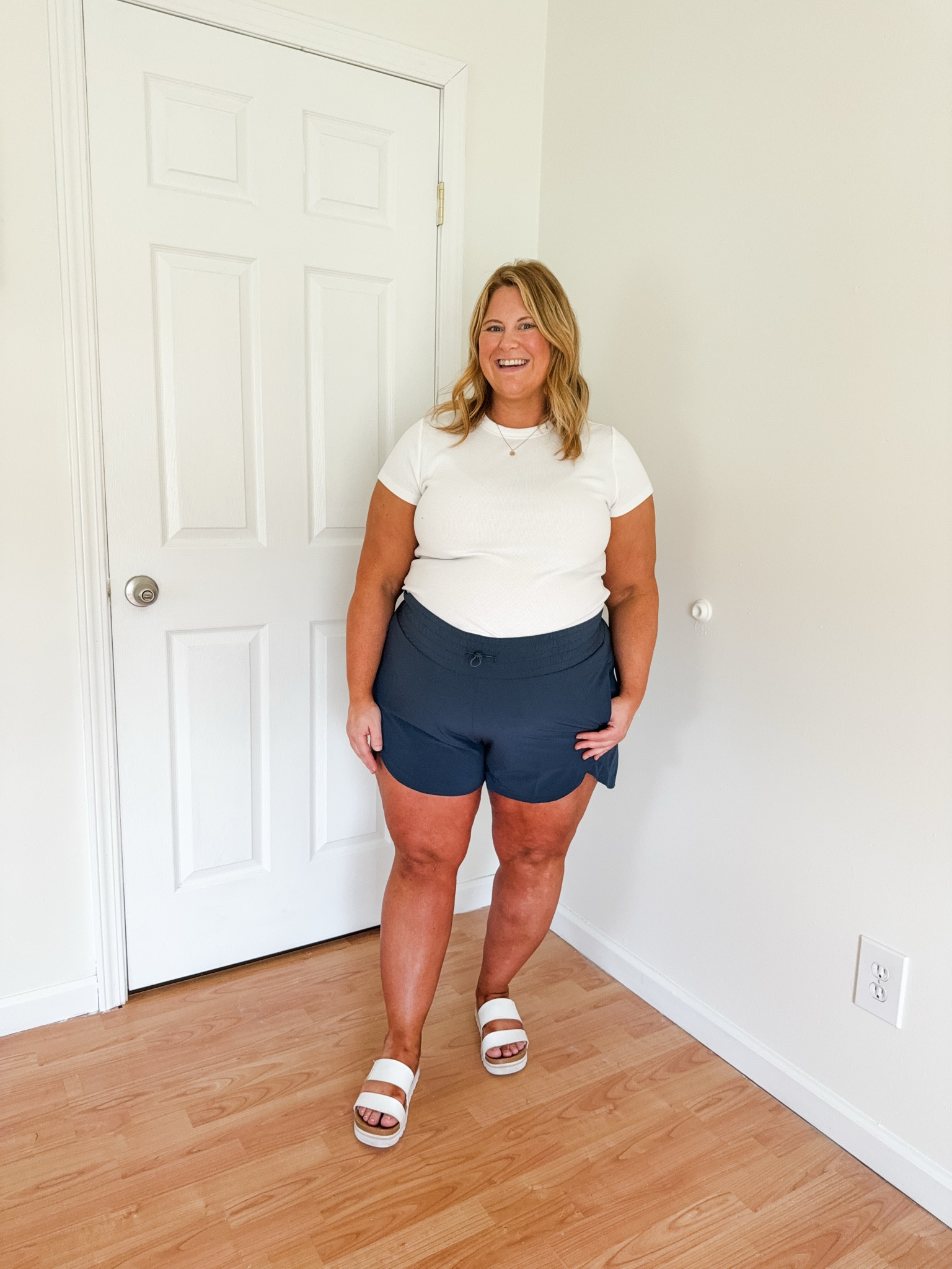 Wearing an XXL in my shorts.  Would do an XL if not pregnant.  Wearing an XL in my tee.