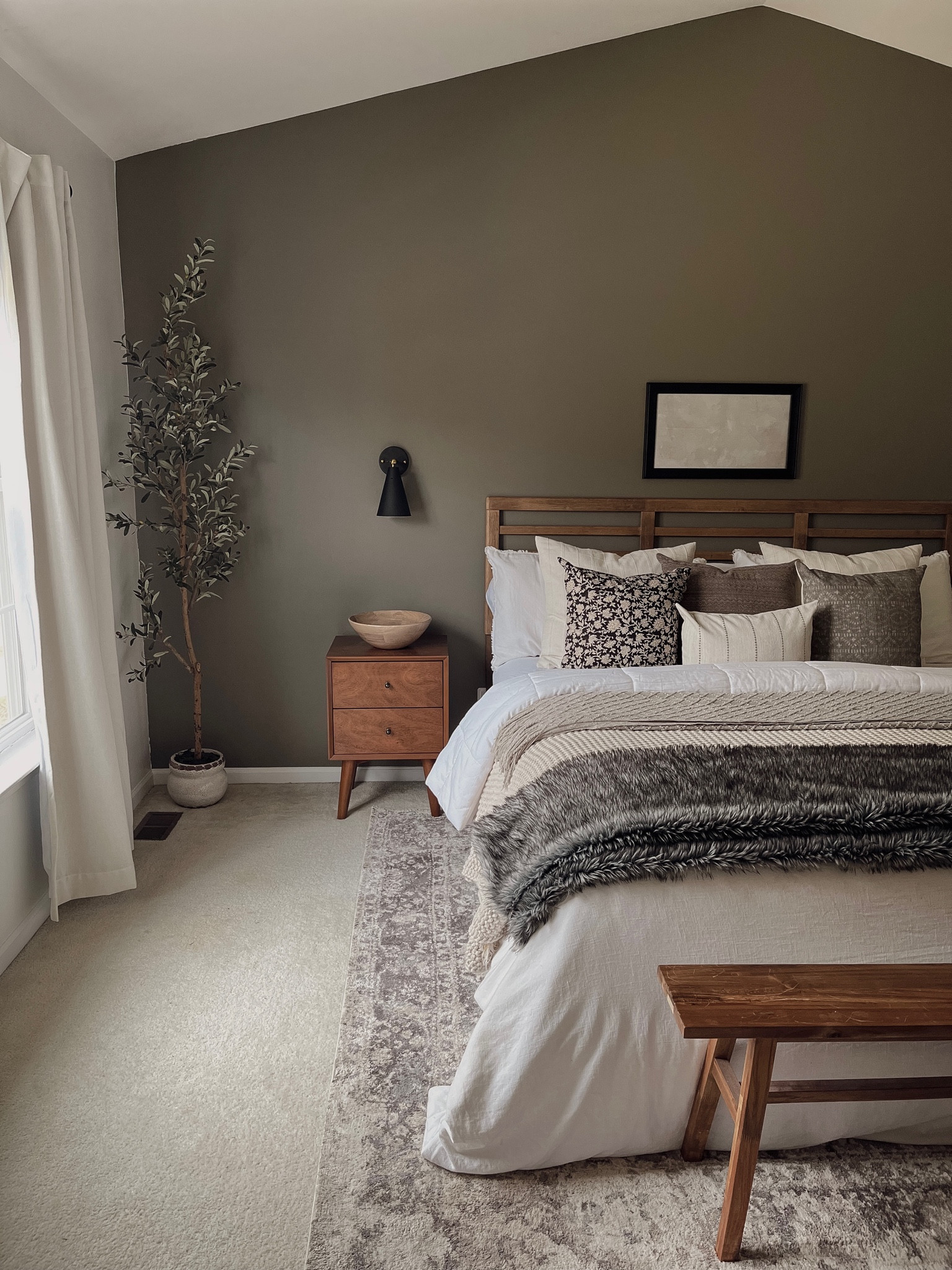 Bedroom inspo, neutral bedroom, moody bedroom, modern furniture, mid century modern nightstand, wooden nightstand, white bedding, throw blanket, Target bedding, wall sconce, bedroom rug, olive tree, wooden headboard