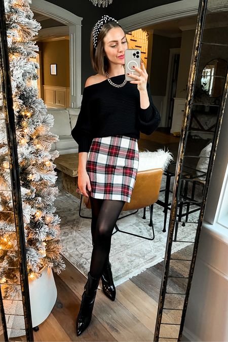 Plaid skirt // Christmas outfit // Christmas photos // black sweater // off the shoulder // dolman sleeve // cozy sweaters // sheer tights // patent boots 

#LTKCyberweek #LTKHoliday #LTKSeasonal