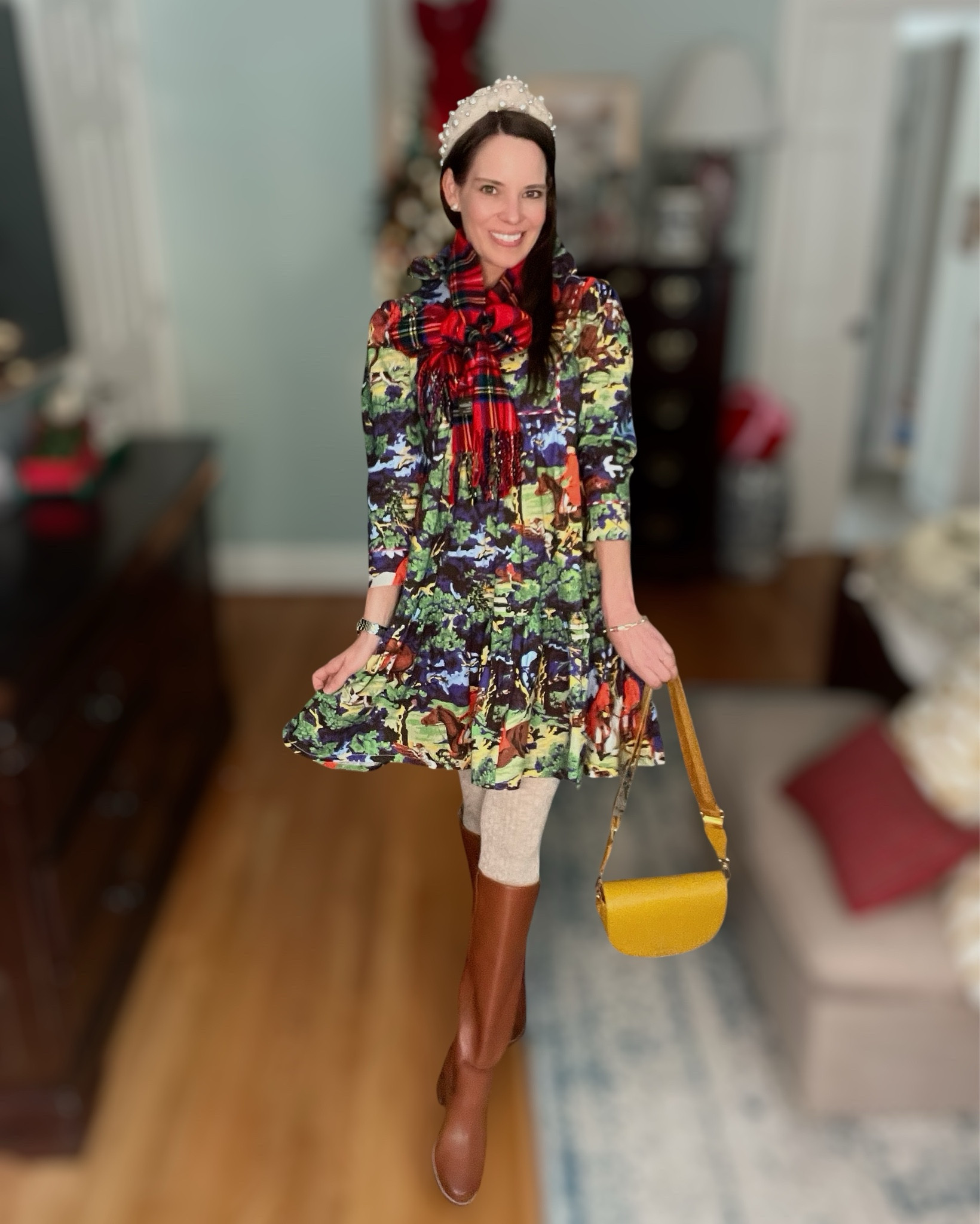 Holiday Gathering Outfit 🍂🎄

A festive, cozy look that works beautifully for both Thanksgiving and the holiday season 🎄🍂 This colorful horse-print dress pops on its own, but layering it with the bold tartan scarf and textured cable tights makes it feel extra warm and wintry. Tall cognac boots keep it classic, and the pearl headband + gold pieces add that polished, girly touch 💛 The mustard crossbody pulls out the golden tones in the dress for the prettiest finished look. Perfect for holiday gatherings, family photos, school events, or a festive day out!

Warm tones • playful print • tartan scarf • cable sweater tights • tall brown boots • pearl headband • festive accessories • winter dress outfit • holiday look • Thanksgiving style • cozy layers • gift-ready accessories

#LTKFindsUnder100 #LTKHoliday #LTKootd