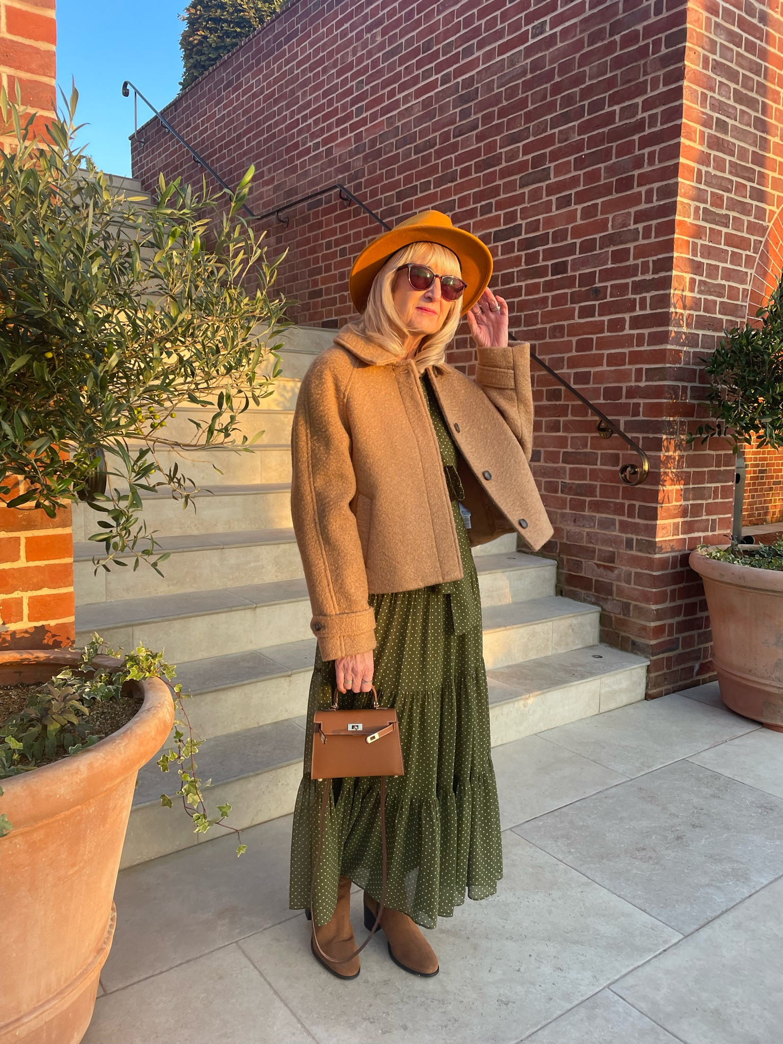 Autumn Outfit 
Cropped light brown wool jacket with a green midi dress, fedora, tan hand held bag and tan suede block heel boots 

#LTKautumn #LTKeurope #LTKuk