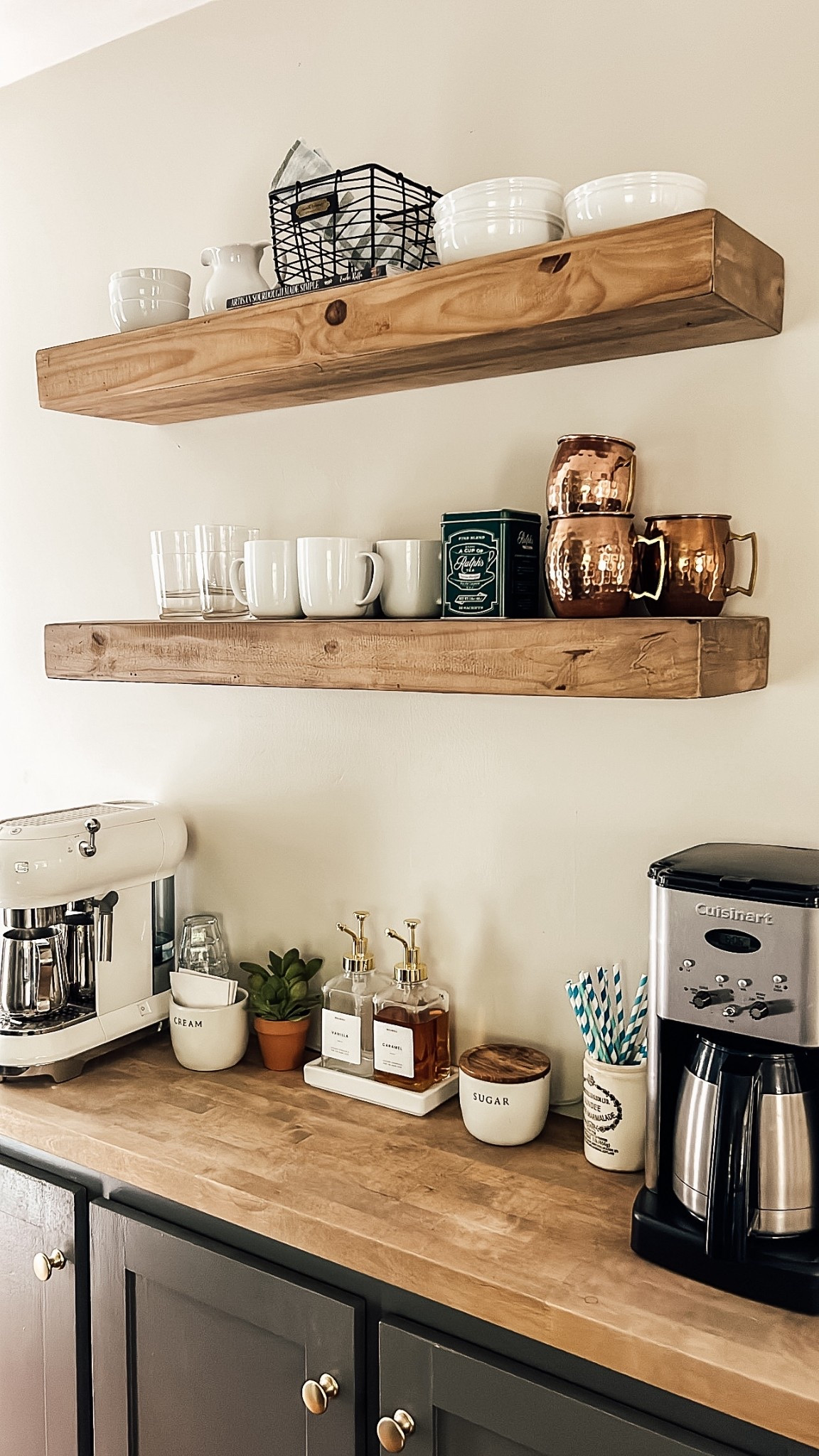 COFFEE BAR | All you need to create a DIY coffee bar: 
- a corner or shelf in your kitchen.
- quality coffee or espresso machine.
- syrups to make your favorite drinks at home.
- a little kitchen decor.

We turned a cabinet we weren’t using into a coffee station by adding a butcher block top, and open shelving above. 🤎


#LTKHome