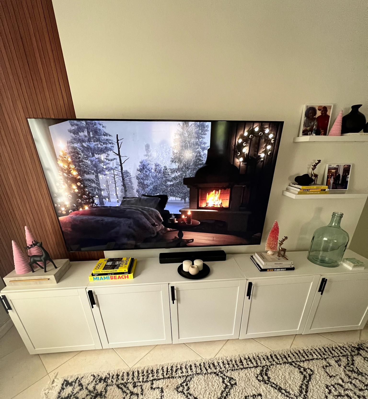 Shop my built-in and accessories. The paneling is wallpaper! #familyroom #cabinets #builtin #coffeetablebooks #vases #photos #floatingshelves

#LTKhome #LTKSeasonal #LTKCyberweek