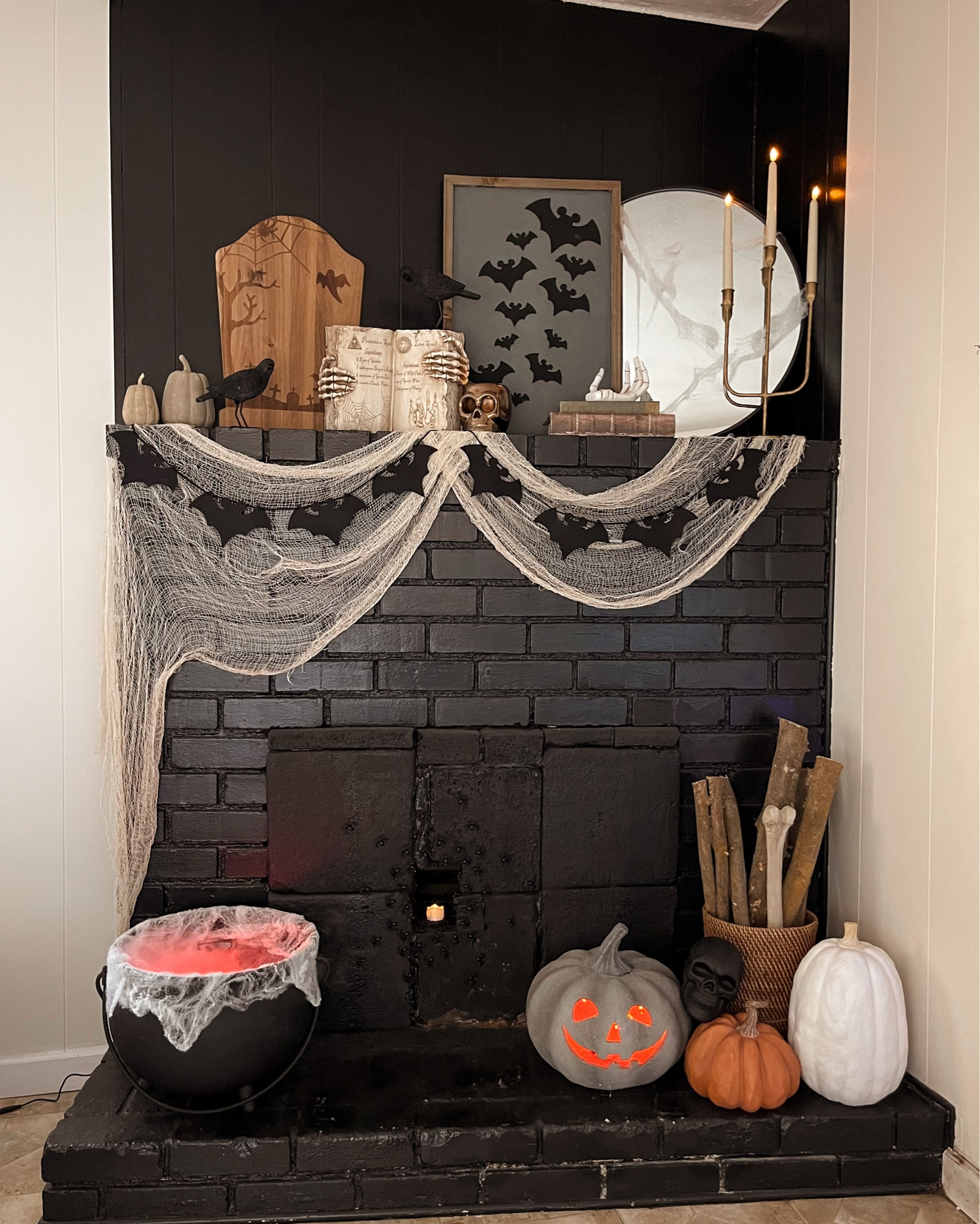 It’s spooky season!!🎃👻

The mirror, books, candelabra, and orange pumpkin are all from Hobby Lobby. The spell book was something I picked up from Michael’s many years ago, but I’ve found similar ones at Home Goods! Both Mickey bat pieces I made! All supplies came from Hobby Lobby and I used my Cricut to cut out all the bats. The black terracotta pumpkin was found at Marshall’s for $19.99! The wood tombstone was a TJ Maxx find last year and I haven’t been able to find anything similar! I get all my creepy cloth and spiderwebs from Dollar Tree. The stone pumpkins and the gold skeleton candle holder are from Target last year, but they have a black version of the candle holder this year!

Halloween Decorations, Halloween Fireplace, Black Fireplace Decorations

#LTKHalloween #LTKVideo #LTKHome