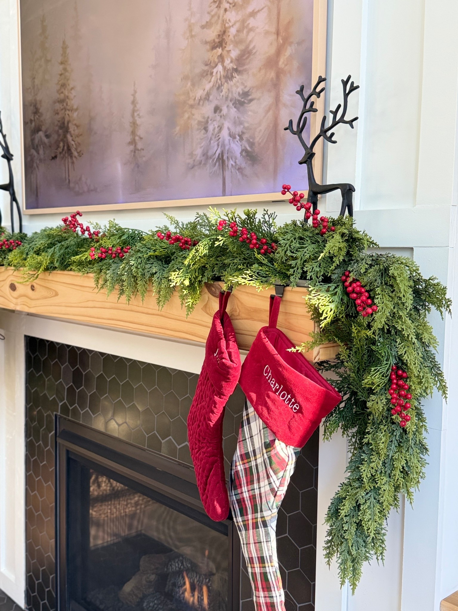 Christmas/Holiday Mantel Decor! 🎄❤️ Love the addition of the red berry stems this year and the reindeer figurines! 

#LTKSeasonal #LTKHome #LTKHoliday