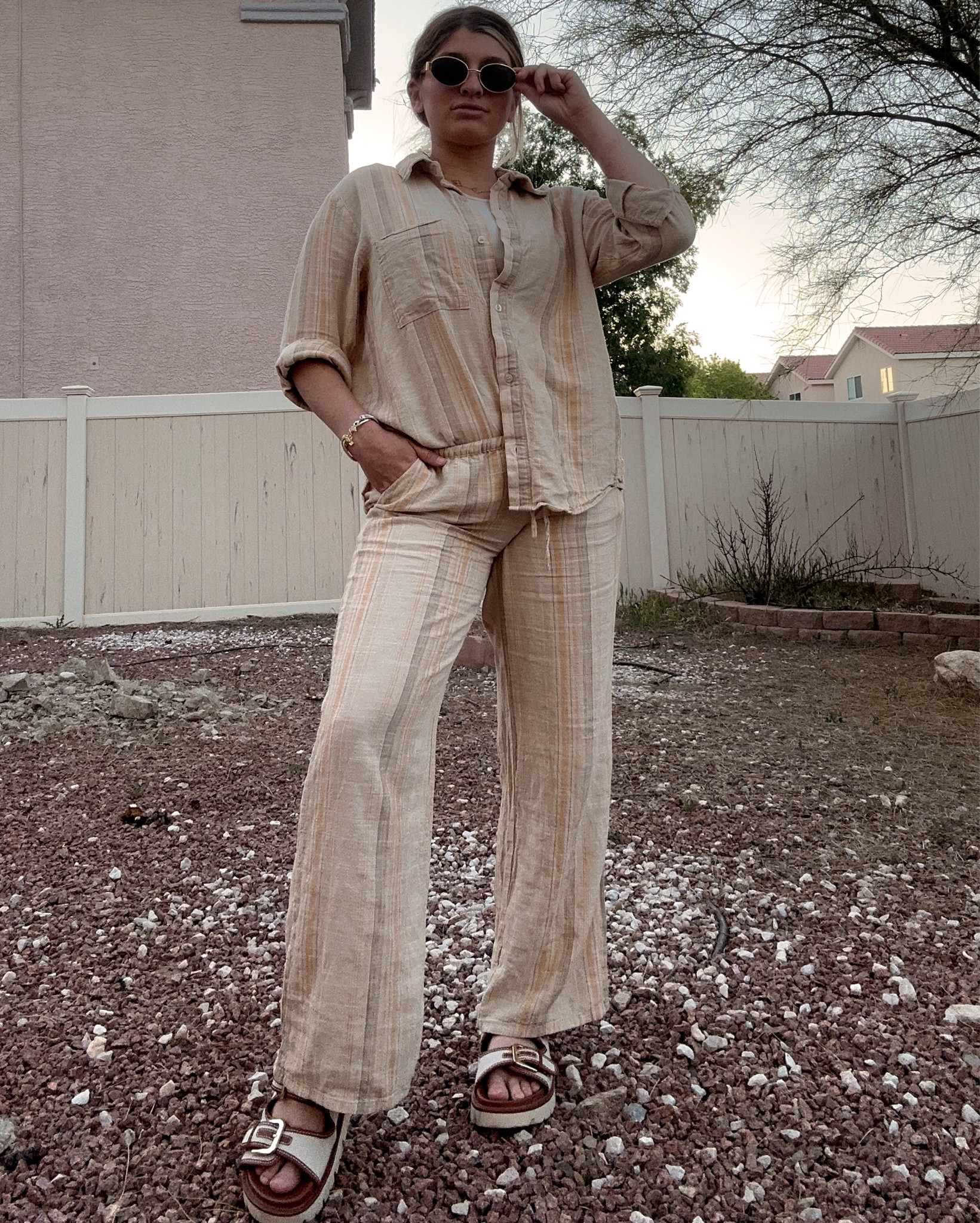 Hands down one of my favorite matching sets! It’s the perfect spring outfit/summer outfit because it’s linen, so it’s very light on the body. This would be a great travel outfit & vacation outfit as well. The sandals are so comfy & cute! They’re sold out in the color I’m wearing, but available in black at H&M!

#traveloutfit #springoutfit #matchingset #linen #linenpants #summeroutfit #sandals #vacationoutfit #hm #amazon #sunglasses #glasses 

#LTKSeasonal #LTKtravel #LTKshoecrush