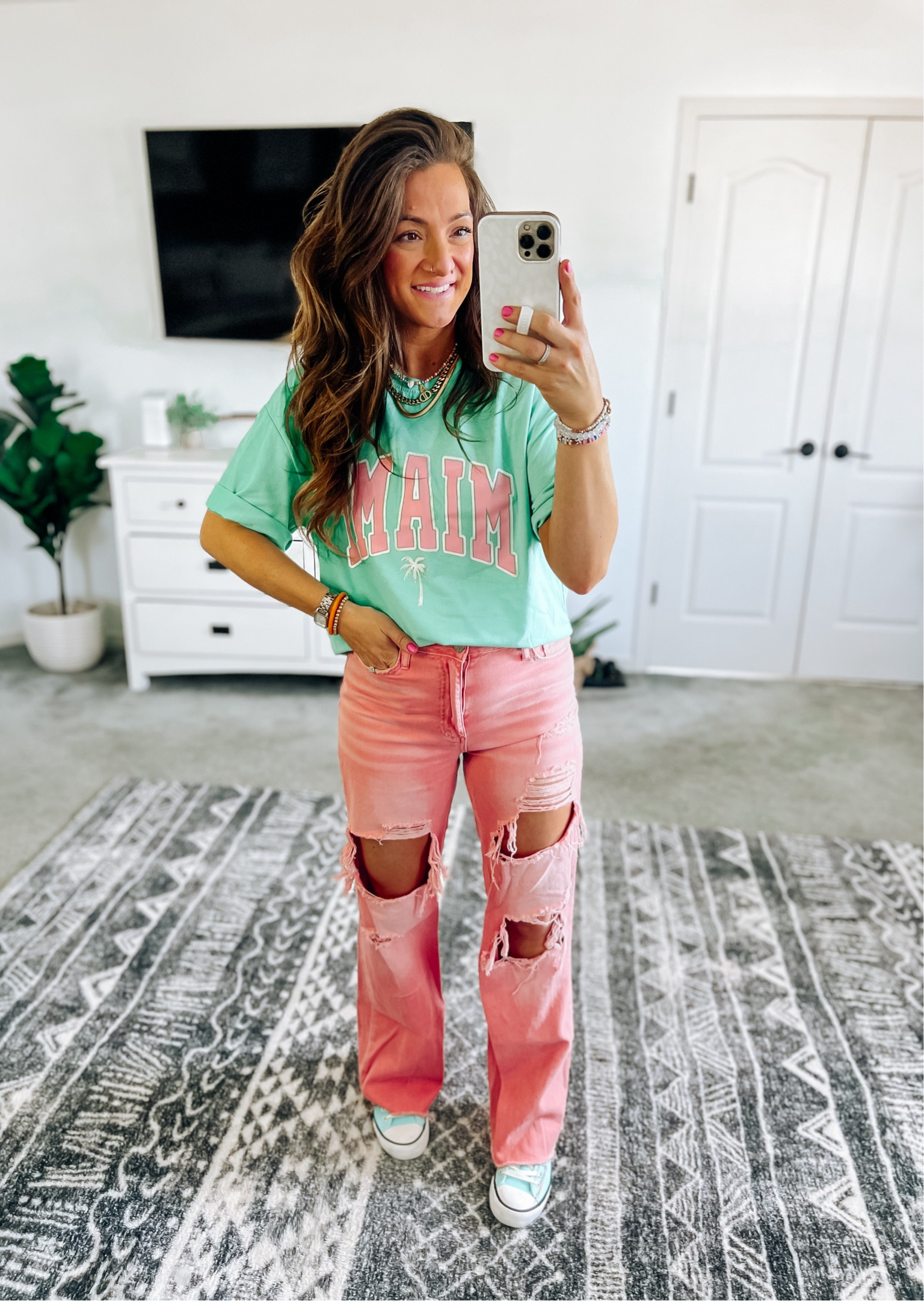 Fun colorful outfit of the day! Graphic tee is super soft and perfectly oversized. Jeans are older so I linked some other options! Look for less shoes are true to size. Use the comment box if you have any questions!

#LTKstyletip #LTKfindsunder50 #LTKfindsunder100