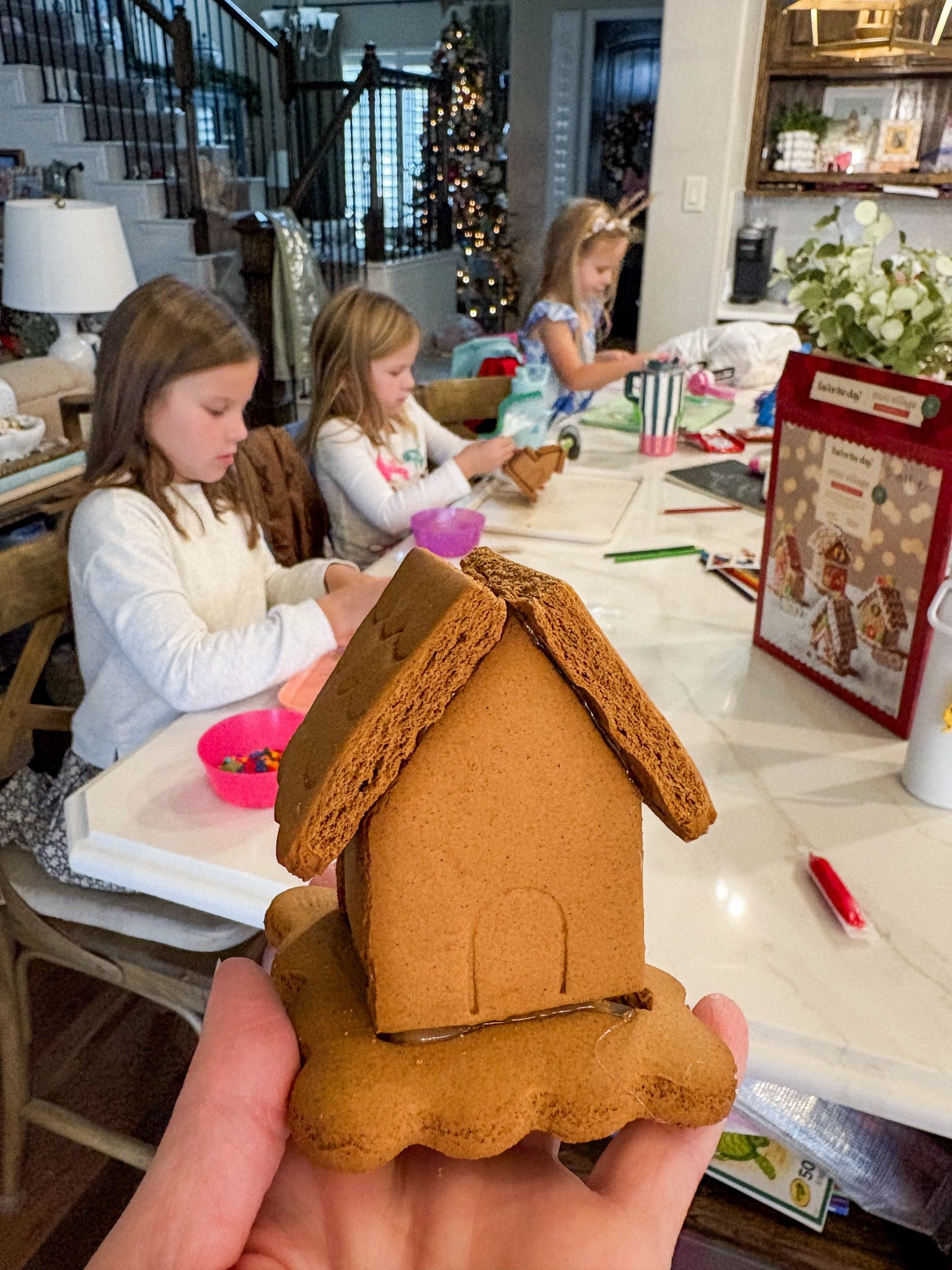 Our elf brings the girls this gingerbread village kit every year. We love it because it comes with four miniature houses so everyone gets one to decorate.

We don’t eat ours, so I put them together with hot glue. That makes decorating so much easier so houses aren’t falling apart in the process. 

#LTKfoodie #LTKHoliday #LTKKids