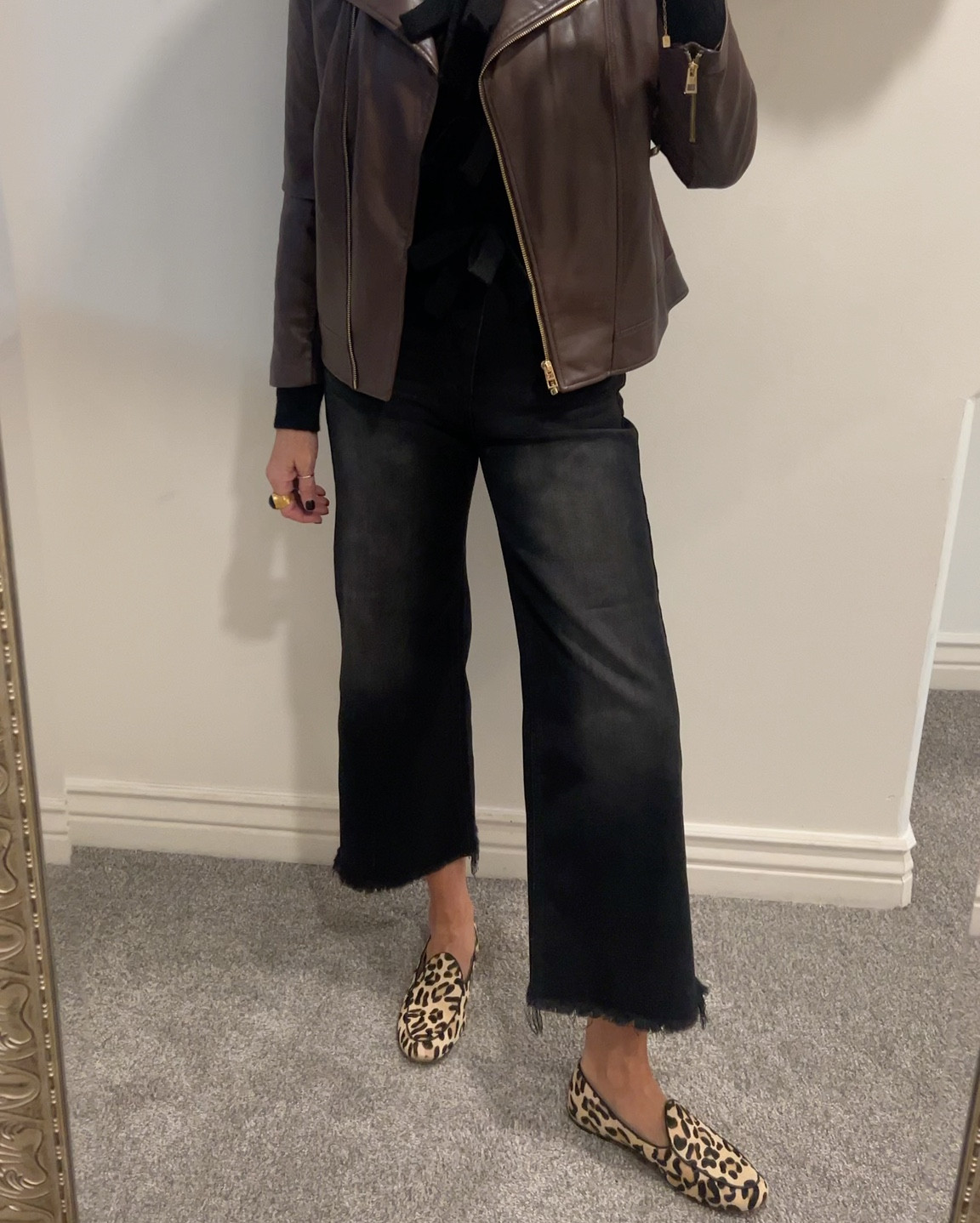 #ootd 
Elevated everyday look or teacher outfit idea✔️ 
Brown and black with a pop of leopard

Risen wide leg cropped  high rise black jeans frayed bottoms, fit tts and so so good! Comfortable and I am in 27 and I am tall  under $70
Feels like premium denim

Black bow sweater super soft cropped and perfect with high waisted tts
Under $70 

Black buttery soft cami tts Pumiey 

Chicos brown faux leather jacket 

Leopard slip on shoes Chicos tts (last years linked similar) 

Amazon belt 2 pack affordable and good quality 

Puff pave initial necklace 
Tennis necklace 

Julie Vos ring
Kate spade stud earrings 


#LTKStyleTip #LTKWorkwear #LTKFindsUnder100